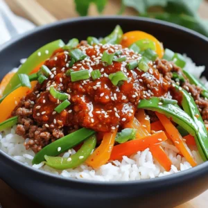- 1 lb (450g) ground beef - 1 tablespoon sesame oil - 3 cloves garlic, minced - 1 inch ginger, grated - 1 tablespoon gochujang (Korean red chili paste) - 2 tablespoons soy sauce - 1 tablespoon brown sugar - 1 tablespoon rice vinegar - 2 green onions, chopped (plus more for garnish) - 1 cup cooked jasmine rice - 1 cup mixed vegetables (like bell peppers, carrots, and snap peas) - Sesame seeds for garnish When making Spicy Korean Beef Bowls, you need fresh and flavorful ingredients. Start with ground beef; it cooks quickly and absorbs flavor well. I always prefer sesame oil for that nutty taste. Garlic and ginger are must-haves. They bring warmth and depth to the dish. Next, we have the flavoring agents. Gochujang is not just spicy; it adds a unique sweetness. Soy sauce brings umami, while brown sugar balances the heat. Rice vinegar adds a tangy kick, which rounds out the flavors beautifully. Finally, for the accompaniments, I use green onions for freshness. Jasmine rice is the perfect base, soaking up all those tasty sauces. Mixed veggies keep the dish bright and colorful, making it fun to eat. Don't forget the sesame seeds for a delightful crunch. Together, these ingredients create a mouthwatering flavor explosion in every bite. You can find the full recipe above to make this dish easily at home. - Heat 1 tablespoon of sesame oil in a large skillet over medium heat. - Add 3 cloves of minced garlic and 1 inch of grated ginger. Sauté for 1 minute. - Increase the heat to medium-high. Add 1 pound of ground beef to the skillet. - Cook the beef, breaking it apart, until it is browned, about 5-7 minutes. - Drain any excess grease from the skillet. - In a bowl, combine 1 tablespoon of gochujang, 2 tablespoons of soy sauce, 1 tablespoon of brown sugar, and 1 tablespoon of rice vinegar. - Pour this sauce over the cooked beef. Mix well to coat every piece evenly. - Allow the beef to cook in the sauce for an additional 2-3 minutes. This lets the flavors meld. - In a separate pan, stir-fry 1 cup of mixed vegetables for about 4-5 minutes. - Cook them until they are tender-crisp. You can use bell peppers, carrots, and snap peas. - Start with a scoop of cooked jasmine rice in a bowl. - Top it with the spicy beef mixture and sautéed vegetables. - Garnish with chopped green onions and a sprinkle of sesame seeds. - Serve immediately for a delicious meal that looks as good as it tastes. For the full recipe, check out the detailed instructions. - Sauté garlic and ginger until fragrant for best flavor. This step builds a solid base for your dish. - Use medium-high heat for browning the beef. This ensures a nice sear and locks in juices. - Serve in deep bowls for a more appealing presentation. Deep bowls can hold all the delicious layers. - Include a dish of extra gochujang for spice lovers. This lets your guests spice up their meal as they like. - Adjust the amount of gochujang based on spice tolerance. Less gochujang makes a milder dish. - Experiment with additional toppings like kimchi. Kimchi adds crunch and a tangy kick to each bite. For the full recipe, check out the complete guide above. {{image_2}} You can switch ground beef for ground turkey or chicken. This makes the dish leaner. If you want a vegetarian meal, use tofu or tempeh. Both options soak up flavors well and add protein. Feel free to mix in seasonal veggies like zucchini or mushrooms. They add great texture and flavor. Leafy greens, such as spinach, boost nutrition and color. Toss them in just before serving for a fresh touch. Top your spicy beef bowl with a fried egg. The runny yolk adds a rich flavor. For a traditional touch, serve with kimchi on the side. Kimchi brings a tangy crunch that pairs well with the spicy beef. Check out the Full Recipe for more ideas! Store your Spicy Korean Beef Bowls in an airtight container in the refrigerator. This keeps the flavors fresh. You should eat them within 3-4 days for the best taste. If you want to save some for later, freeze the beef mixture separately from the rice and vegetables. This helps keep everything tasting great. Use the frozen parts within 1-2 months for optimal quality. To enjoy your meal again, reheat it on the stovetop or in the microwave. Make sure it's hot all the way through. Add a splash of water when reheating. This keeps the beef moist and tasty. Enjoy your flavorful bowl again! For the full recipe, check out the details above. Gochujang is a thick red paste made from chili powder, glutinous rice, fermented soybeans, and salt. This paste adds a unique, sweet, and spicy flavor to many Korean dishes. It is a key ingredient in Spicy Korean Beef Bowls. The heat level of gochujang can vary, but it brings a rich depth to the dish. You will love how it elevates the beef with its umami taste. Yes, you can prepare this recipe in advance. Cook the beef and vegetables ahead and store them separately. Keep everything in airtight containers in the fridge. You can also cook the rice ahead of time. This makes meal prep easy and quick for busy days. Just reheat everything when you're ready to eat. You can serve this dish with many tasty sides. Try pickled vegetables for a refreshing crunch. A simple cucumber salad works well, too. You might enjoy a light soup like miso for a warm touch. For drinks, serve iced green tea or a light beer. These pair nicely with the spicy flavors. Absolutely! Portion the beef and veggies into containers. Pair each portion with rice. This way, you have a complete meal ready to go. Store in the fridge for up to four days. You can also freeze it for longer storage. Just make sure to reheat it thoroughly before enjoying. To tone down the spice, use less gochujang in the recipe. Start with half a tablespoon, then taste it. You can also add more sugar to balance the heat. Mixing in creamy ingredients like sour cream can help, too. This will make the dish more enjoyable for those who prefer less heat. This recipe for Spicy Korean Beef Bowls combines simple ingredients that pack a punch. We covered the key components, from the tender ground beef to the flavor-rich gochujang sauce. You can customize it with different proteins and veggies. Remember, meal prep makes life easier. Store leftovers properly to enjoy this dish later. Whether you serve it for lunch or dinner, this bowl is sure to satisfy. Don't hesitate to try your own variations and enjoy!