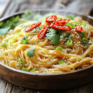 To make the best spicy garlic noodles, you need a few key ingredients: - 8 oz. stir-fry noodles (like egg or rice noodles) - 4 tablespoons vegetable oil - 6 cloves garlic, minced - 1-2 red chilies, sliced (adjust to taste) - 2 tablespoons soy sauce - 1 tablespoon sesame oil - 1 tablespoon sriracha (or more for extra heat) - 1 teaspoon sugar - 2 green onions, finely chopped - 1 tablespoon chopped fresh cilantro (optional) - Sesame seeds for garnish These ingredients create a rich and spicy flavor that is hard to resist. The garlic gives a nice aroma, while the chilies add heat. The sauces blend together for a tasty coating on the noodles. You can easily customize your spicy garlic noodles. Here are some optional ingredients to consider: - Vegetables like bell peppers or broccoli for crunch - Proteins such as chicken, shrimp, or tofu for more substance - Lime juice for a fresh zing - Peanut butter for a creamy twist Feel free to mix and match these ingredients to suit your taste. This recipe adapts well to different preferences and dietary needs. Using quality ingredients makes a big difference. Here are some brands I trust for this recipe: - Noodles: Annie Chun's or House Foods for reliable stir-fry noodles - Soy Sauce: Kikkoman or Bragg's for a rich flavor - Sriracha: Huy Fong Foods for authentic heat - Sesame Oil: Kadoya for a nice nutty taste These brands enhance the dish’s flavor and quality. Using good ingredients ensures your spicy garlic noodles taste amazing. For the full recipe, check out the detailed instructions. First, take 8 oz. of stir-fry noodles, like egg or rice noodles. Bring a pot of water to a boil. Cook the noodles for about 4-6 minutes. Make sure they are al dente, so they stay firm. Drain the noodles and set them aside. This step is key for a great texture in your dish. In a large skillet or wok, pour in 4 tablespoons of vegetable oil. Heat it over medium heat. Add 6 minced garlic cloves and 1-2 sliced red chilies. Sauté these for 1-2 minutes until you smell that wonderful garlic fragrance. Be careful not to burn the garlic, as it can turn bitter. Next, mix in 2 tablespoons of soy sauce, 1 tablespoon of sesame oil, 1 tablespoon of sriracha, and 1 teaspoon of sugar. Stir well and let the sauce simmer for about a minute. This allows the flavors to come together nicely. Now it’s time to bring it all together. Add the cooked noodles to the skillet with the sauce. Toss the noodles to coat them evenly in the sauce. Stir-fry for an additional 2-3 minutes until everything is heated through. Remove from heat and stir in 2 finely chopped green onions. Serve hot, and feel free to garnish with fresh cilantro and sesame seeds. This will make your dish not just tasty but also visually appealing. Enjoy your Spicy Garlic Noodles! For the complete process, check the Full Recipe. To get that great garlic taste, use fresh garlic. Fresh garlic has a strong flavor. Mince the garlic finely for even more taste. Heat it gently in oil. This way, it gets soft and fragrant. Don’t let it burn, or it will taste bitter. Sauté it for just 1-2 minutes until it turns golden. This is when the magic happens! Spice is fun but can be too much. Start with one red chili. Taste the dish as you cook. If you like more heat, add another chili or more sriracha. Everyone’s taste is different, so feel free to adjust. You can even skip the chilies if you want a milder dish. When stir-frying, keep the heat high. This helps the noodles cook quickly and evenly. Make sure to toss the noodles often. This keeps them from sticking together. If they do stick, a splash of water can help. Always use a large skillet or wok. This gives you room to move the noodles around easily. Follow these tips, and your noodles will be perfect every time! For a complete guide, check out the Full Recipe. {{image_2}} You can easily make this dish vegetarian-friendly. Simply skip any meat and focus on veggies. Add colorful bell peppers, broccoli, or snap peas for crunch and flavor. You can also substitute regular noodles with whole grain or gluten-free noodles. This change keeps the meal light and healthy. To make these noodles vegan, replace the egg noodles with rice noodles. Always check the soy sauce; choose a brand without animal products. You can also add tofu for protein. Firm tofu works best. Just cube it and pan-fry until golden. This method adds a nice texture and flavor. Adding protein turns this dish into a hearty meal. For tofu, follow the vegan method. For chicken, sauté bite-sized pieces until cooked through before adding garlic. Shrimp cooks fast, so toss it in at the same time as the noodles. Just watch it turn pink; this means it’s ready. Each protein adds its flavor, making the dish even better. For the full recipe, check out the entire guide to Spicy Garlic Noodles. After enjoying your Spicy Garlic Noodles, store any leftovers. Place them in an airtight container. This keeps the flavors fresh. You can keep them in the fridge for up to three days. Make sure to cool them down before sealing. This helps prevent condensation and sogginess. When you’re ready to eat them again, reheating is key. The best way is to use a skillet. Heat a bit of oil over medium heat. Add the noodles, stirring them gently. This brings back their texture and flavor. If you prefer, you can also microwave them. Just add a small splash of water and cover the bowl. Heat in short bursts until warm. Stir in between to heat evenly. If you want to save some for later, freezing is an option. Let the noodles cool completely, then place them in a freezer-safe bag. Squeeze out as much air as you can. This prevents freezer burn. You can freeze them for up to three months. When you’re ready to eat, thaw them in the fridge overnight. Reheat as mentioned above for the best taste. For the full recipe, check the complete guide above. You can use many types of noodles for this dish. I often use stir-fry noodles like egg or rice noodles. They cook fast and soak up the sauce well. You can also try udon or soba noodles for a different bite. Just make sure to follow the cooking time on the package. It’s key to get them just right. To tone down the heat, you can reduce the number of red chilies. Use only one chili instead of two. You can also skip sriracha or use a milder sauce. Adding more sugar balances the heat nicely. Another trick is to mix in extra noodles or vegetables. This spreads out the spice, making it more mild. Yes, you can make these noodles ahead of time. Cook them and let them cool. Store in an airtight container in the fridge. They will last for about three days. When you're ready to eat, just reheat them in a skillet. Add a splash of water or oil to avoid sticking. This way, you can enjoy a quick meal anytime. For the full recipe, check out the section above. Spicy garlic noodles are a tasty dish you can make at home. We covered key ingredients, preparation steps, and ways to customize your meal. I shared tips on getting the best garlic flavor and adjusting spice levels. You can even explore vegetarian and vegan options or add protein. Proper storage helps keep leftovers fresh. With this guide, you'll have everything needed to enjoy delicious noodles anytime. Get cooking, and enjoy the process!