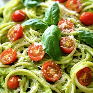 - 2 ripe avocados, pitted and peeled - 2 cups fresh basil leaves - 2 cloves garlic, minced - 2 tablespoons lemon juice - 1/4 cup olive oil - Salt and pepper to taste - 12 oz spaghetti or your choice of pasta - 1/4 cup grated Parmesan cheese (optional) - Cherry tomatoes, halved (for garnish) When I make Easy Avocado Pasta, I always start with fresh, ripe avocados. They should feel soft but firm. Next, I grab a bunch of bright green basil leaves, which add a lovely aroma. I also use garlic for a little kick. For the extra ingredients, I squeeze fresh lemon juice. This adds a bright flavor that balances the creaminess. I use high-quality olive oil for richness and depth. Simple salt and pepper bring everything together. I usually choose spaghetti, but you can use any pasta that you love. If I want to make it extra special, I sprinkle in some grated Parmesan cheese. And for a pop of color, I love adding halved cherry tomatoes on top. This dish is a perfect blend of creamy and tangy flavors. You can find the Full Recipe to get all the steps needed to make it delicious! Start by boiling a pot of salted water. Once it boils, add your pasta. Follow the package instructions for the cooking time. Remember to reserve 1 cup of pasta water before you drain the pasta. This water is key for your sauce later. Next, grab a food processor. Add in your ripe avocados, fresh basil leaves, minced garlic, lemon juice, and olive oil. Blend everything until it’s smooth and creamy. If the sauce is too thick, slowly add some of the reserved pasta water. This will help you reach a nice, creamy texture. Now, it’s time to season the avocado sauce. Add salt and pepper to taste. In a large bowl, combine the cooked pasta with the avocado sauce. Toss well to coat the pasta evenly. If the sauce needs more moisture, add a bit more reserved pasta water. For a tasty touch, mix in some grated Parmesan cheese if you like. Enjoy your creamy avocado pasta! For the full recipe, check out the details above. To make your avocado pasta even better, consider these simple tips: - Adding more lemon juice for tanginess: Lemon juice brightens the dish. If you like a zesty kick, squeeze in more lemon juice. Start with one tablespoon and taste. You can always add more if you want. - Using fresh herbs for extra flavor: Fresh herbs can change the game. Try adding parsley, cilantro, or chives. Chop them finely and mix them in. This will give your dish a fresh and vibrant taste. Getting the right consistency is key for a creamy sauce. Here’s how to do it: - How to adjust sauce thickness with pasta water: Pasta water is your secret weapon. If your sauce is thick, add a little pasta water. Mix well until you reach the creaminess you want. This makes all the difference. - Avoiding browning of avocados: Avocados can brown quickly. To prevent this, use them right away. If you have leftovers, cover the dish tightly. You can also sprinkle lemon juice on top to help keep the color fresh. These tips will help you create a creamy and flavorful avocado pasta that everyone will love. For the complete steps, check the Full Recipe. {{image_2}} To make this dish vegan, you can easily swap out the Parmesan cheese. Use nutritional yeast instead. This ingredient gives a cheesy flavor without any dairy. It works great and keeps the dish creamy. You might also want to add nuts, like cashews or pine nuts. They add richness and a nice texture. Just blend them in with the avocado for a creamy sauce that everyone will enjoy. If you need a gluten-free meal, choose gluten-free pasta like brown rice or quinoa pasta. These options cook well and taste great. They keep the dish light and tasty. To maintain the texture of the dish, make sure not to overcook the gluten-free pasta. Check it a minute or two before the package says it’s done. This way, it stays firm and delicious. Feel free to explore these variations to suit your diet. They keep the essence of the dish while offering new tastes. For the full recipe, check the link above. To keep your avocado pasta fresh, place it in an airtight container. This helps prevent the dish from absorbing odors in the fridge. I recommend storing it in the fridge within two hours of making it. This will help keep it safe to eat. Avocado pasta stays fresh for up to three days. However, the color may darken over time due to the avocados. To slow this down, add a bit of lemon juice to the top before sealing the container. When you are ready to eat the leftovers, use gentle heat to warm the pasta. A skillet works well for this. Add a splash of olive oil or pasta water. This keeps the sauce creamy and prevents it from drying out. You can also use a microwave. Place the pasta in a safe dish and cover it. Heat it for 30 seconds at a time, stirring in between. If the dish seems dry, add a bit of water. For a tasty twist, toss in fresh herbs or extra cherry tomatoes after reheating. This adds a pop of freshness back into your meal. Enjoy your creamy avocado pasta as if it were fresh! Avocado pasta stays fresh for about three days in the fridge. To store it, place the pasta in an airtight container. Cover the top with plastic wrap to limit air exposure. This helps slow down browning. If you notice any browning, you can mix in a little lemon juice before serving. This will brighten the color and taste. Yes, you can prepare this dish ahead of time. Cook the pasta and make the avocado sauce separately. Store them in the fridge in airtight containers. When you are ready to eat, mix them together. If the sauce thickens, add a bit of reserved pasta water to loosen it. This keeps the dish fresh and tasty without losing flavor. You can add many protein options to make this dish heartier. Chicken is a great choice; just grill or sauté it before adding. Chickpeas add a nice texture and flavor. Simply rinse and toss them in. Tofu is another option; pan-fry it for a crispy bite. All these additions make the avocado pasta more filling and nutritious. This blog post covered a simple and tasty avocado pasta recipe. You learned about the main ingredients and step-by-step cooking instructions. There are also tips for enhancing flavor and keeping your sauce perfect. I shared options for vegan and gluten-free versions. Finally, we discussed how to store leftovers and reheat them well. Enjoy making this healthy dish. It is easy and full of flavor. You can customize it to fit your taste. Happy cooking!