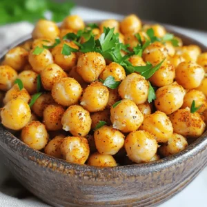 - 1 can (15 oz) of chickpeas (garbanzo beans) - 2 tablespoons olive oil - 1 teaspoon smoked paprika - 1 teaspoon garlic powder - 1/2 teaspoon cumin - 1/2 teaspoon salt - 1/4 teaspoon black pepper - Fresh parsley (for garnishing) - Alternative oils and spices I love using chickpeas in my cooking. They are tasty and packed with protein. For this recipe, I use a can of chickpeas. Make sure to drain and rinse them well before cooking. This helps remove excess sodium and makes them fresher. Next, I add olive oil. It not only helps the spices stick but also adds flavor. The spices I use are smoked paprika, garlic powder, cumin, salt, and black pepper. Each spice brings its own unique taste. Smoked paprika adds a hint of smokiness, while garlic powder gives a nice punch. If you want to take it up a notch, consider adding fresh parsley. It adds color and makes the dish look pretty. You can also try different oils or spices if you like. For example, you could use chili powder for some heat or even a sprinkle of cinnamon and sugar for a sweet twist. This simple list of ingredients makes for a quick and healthy snack. I keep it easy so you can whip this up anytime. Plus, it’s fun to play around with flavors to find what you love best! If you want the full recipe with all steps, check out the link. - Preheat air fryer to 400°F (200°C). - Rinse and dry chickpeas. Start by preheating your air fryer. This step helps the chickpeas get crispy. While the air fryer heats, rinse the chickpeas. Drain them well and spread them on a clean kitchen towel. Pat them dry to remove any extra moisture. Drying is key to achieving a great crunch. - Coat chickpeas with oil and spices. - Air fry chickpeas for 15-20 minutes. In a large bowl, mix the dried chickpeas with olive oil and spices. Use smoked paprika, garlic powder, cumin, salt, and black pepper. Toss until every chickpea is covered with the mix. Next, place the chickpeas in the air fryer basket in an even layer. Make sure they aren’t crowded; this helps them cook evenly. Air fry the chickpeas for 15 to 20 minutes. Shake the basket halfway through. This ensures all sides get crispy. - Garnish with parsley. - Cooling tips for maximum crispiness. Once the chickpeas are done, take them out and let them cool for a few minutes. They will get even crunchier as they cool. If you want, sprinkle some chopped parsley on top for a fresh touch. Enjoy this snack as is or with a tasty dip. For the full recipe, check out the guide above! To get that satisfying crunch, preheat your air fryer to 400°F (200°C). This step gets the air circulating quickly. While you wait, drying the chickpeas is key. After rinsing, spread them on a towel and pat them dry. Removing moisture helps them crisp up nicely. For flavor, mix spices with olive oil. I love using smoked paprika and garlic powder. They add a great taste. You can also try cumin, salt, and black pepper. If you want more heat, add chili powder. For a sweet twist, sprinkle cinnamon and sugar. Crispy chickpeas taste great with dips! Try serving them with hummus or tzatziki. You can also toss them into salads for a crunch. For a fun idea, mix them into popcorn for a unique snack. These chickpeas are versatile and sure to please. For the full recipe, check out the Crispy Air Fryer Chickpeas 🥗. {{image_2}} You can change the flavor of your crispy air fryer chickpeas easily. For a spicy kick, add chili powder or cayenne. Just a pinch can make a big difference. If you prefer a sweet treat, sprinkle some cinnamon and sugar on top. This gives your chickpeas a tasty twist. Both options are simple and fun to try. If you want to mix things up, try oven-baked chickpeas. They will have a different texture. Preheat your oven to 400°F (200°C) and spread the seasoned chickpeas on a baking sheet. Bake for about 25 to 30 minutes, stirring halfway. You can also use a frying pan on the stovetop. Heat some oil, add the chickpeas, and cook, stirring often, until golden. Each method brings out nice flavors. Crispy chickpeas are great for many diets. They are naturally gluten-free and vegan. You can enjoy them without worry. If you have nut allergies, these chickpeas are safe too. They make a perfect snack or topping for salads. Feel free to adapt the recipe based on your needs. To keep your crispy air fryer chickpeas fresh, store them in an airtight container. This helps maintain their crunch. If you leave them in the open air, they will lose their texture and taste. The best storage duration is about 3 to 5 days. After this time, they may become stale. When reheating, you want to make them crispy again. The best way is to use the air fryer. Set it to 350°F (175°C) and heat for about 5 minutes. This method keeps them crunchy. Avoid microwaving them, as it makes them soggy. These chickpeas are great in salads or as snacks. Toss them in a salad for added crunch. You can also mix them with nuts for a tasty snack. For long-term storage, consider freezing them. Just spread them on a tray and freeze before storing in a bag. This keeps them fresh longer. You can also use them in different recipes later. Check out the Full Recipe for more ideas! Yes, you can use dried chickpeas. First, soak them overnight in water. This helps them soften. Next, drain and rinse them well. You will need to cook them before air frying. Boil them for about 1 hour until tender. Then, follow the same steps in the recipe. This gives you a fresher taste. Some of the best air fryer brands include Philips, Ninja, and Cosori. These brands receive good reviews from users. They cook evenly and have great features. Check the capacity to fit your needs. A larger basket allows more chickpeas at once. To avoid burnt chickpeas, watch the cooking time closely. Start with 15 minutes and check for doneness. If they look golden, they are ready. If not, add a few more minutes. Also, shake the basket halfway through cooking. This helps them cook evenly. Adjust the temperature slightly lower if needed. In this post, we covered how to make crispy chickpeas in an air fryer. We discussed key ingredients, from chickpeas to spices, and walked through step-by-step instructions. You learned tips for the perfect crispy texture, as well as delicious variations to try. Don't forget the storage tips to keep leftovers fresh! Overall, crispy chickpeas are a simple, tasty snack. With creativity, you can make them fit any diet or meal. Enjoy making your own batch!