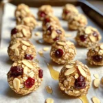 - 1 cup rolled oats - 1/2 cup almond butter - 1/4 cup honey or maple syrup - 1/2 cup dried cherries, chopped - 1/4 cup sliced almonds - 1/2 teaspoon vanilla extract - 1/4 teaspoon salt - 1/2 teaspoon cinnamon These ingredients come together to create tasty Cherry Almond Breakfast Bites. Each item plays a vital role in flavor and texture. Each serving has about 150 calories. These bites provide fiber from oats, healthy fats from almond butter, and antioxidants from cherries. You get energy and nutrients in every bite. If you need a nut-free option, use sunflower seed butter instead of almond butter. For dried cherries, you can use raisins or dried cranberries. If you want a different sweetener, try agave syrup or coconut sugar. Mixing the base ingredients Start by grabbing a large mixing bowl. Add 1 cup of rolled oats, 1/2 cup of almond butter, and 1/4 cup of honey or maple syrup. Then, pour in 1/2 teaspoon of vanilla extract, 1/4 teaspoon of salt, and 1/2 teaspoon of cinnamon. Mix these ingredients well until they form a dough-like texture. This step is fun, and the smell is amazing! Adding cherries and almonds Next, fold in 1/2 cup of chopped dried cherries and 1/4 cup of sliced almonds. Make sure they are evenly mixed throughout the base. This adds a sweet and nutty flavor to your bites. Refrigeration before rolling Now, cover the bowl and place it in the refrigerator for about 30 minutes. Chilling the mixture makes it easier to handle. It also helps the flavors blend nicely. Shaping the bites into balls Once chilled, take the mixture out. Use your hands to scoop small spoonfuls and roll them into balls, about 1 inch in size. This step is perfect for getting your hands a bit messy, but it’s totally worth it! Final refrigeration tips After shaping, line a baking tray with parchment paper. Place each cherry almond bite on the tray. Once all bites are on, return them to the fridge for another 15-20 minutes. This helps them set and hold their shape. Serving suggestions You can serve these bites chilled or at room temperature. They make a great breakfast or snack option. Enjoy them with your favorite drink or share them with friends! For the full recipe, check out the Cherry Almond Breakfast Bites. To make Cherry Almond Breakfast Bites, the right consistency is key. You want a dough-like texture that holds together. If it is too dry, add a little more almond butter or honey. If it is too wet, add more oats. Finding that perfect balance makes all the difference. Handling the mixture can be tricky since it may be sticky. Refrigerate it for about 30 minutes before rolling. This chill time helps firm it up. You can also wet your hands slightly to prevent sticking while you shape the bites. You can easily customize these bites. Try adding protein powder to boost nutrition. A scoop or two can enhance the flavor without changing the texture much. Feel free to mix in different fruits or nuts. Swap dried cherries for raisins or cranberries. You could also use walnuts or pecans instead of sliced almonds. This adds new tastes and textures. Cherries have many nutritional benefits. They are rich in antioxidants and vitamins. Eating cherries can help reduce inflammation and improve sleep. Almond butter also offers great advantages. It is a good source of healthy fats and protein. Almonds can help lower cholesterol and support heart health. Together, these ingredients make a tasty and healthy snack. {{image_2}} You can easily switch up the flavor of Cherry Almond Breakfast Bites. Here are two tasty options: - Chocolate Cherry Almond Bites: Add 1/4 cup of cocoa powder to the base mix. This gives a rich, chocolatey taste that pairs well with cherries. You can also fold in chocolate chips for extra sweetness. - Coconut Cherry Almond Bites: Mix in 1/4 cup of shredded coconut. This adds a chewy texture and tropical flavor. You can top each bite with a sprinkle of coconut for a fun look. Need to make some changes for your diet? Here are some easy swaps: - Vegan or gluten-free versions: Use maple syrup instead of honey to keep it vegan. For gluten-free bites, check that your oats are certified gluten-free. - Low-sugar alternatives: If you want less sugar, reduce the honey or maple syrup by half. You can also use a sugar substitute like stevia or monk fruit. Using seasonal ingredients can enhance your bites: - Using fresh cherries in season: When cherries are in season, you can substitute dried cherries with fresh ones. Chop them up and fold them into the mix for a juicy burst. - Incorporating seasonal spices: Try adding a pinch of nutmeg or pumpkin spice during fall. This gives your bites a warm, cozy flavor that is perfect for cooler weather. To keep your Cherry Almond Breakfast Bites fresh, use an airtight container. Glass containers or plastic food storage boxes work great. Store them in the fridge to maintain their taste and texture. This snack stays best when kept cold. These bites last about one week in the fridge. Check for signs of spoilage, like a change in smell or appearance. If they look dry or hard, it's best to toss them. Fresh bites should be chewy and aromatic. You can freeze Cherry Almond Breakfast Bites for longer storage. To freeze, place them in a single layer on a baking sheet. Once frozen, transfer them to a freezer bag. Make sure to remove as much air as possible to avoid freezer burn. When you're ready to enjoy them, thaw the bites in the fridge overnight. You can also let them sit at room temperature for about 30 minutes. Enjoy your tasty snack straight from the fridge or at room temp! You should refrigerate the mixture for about 30 minutes. This step is key. It makes the mixture firm. A firmer mixture helps you shape it into bites easily. Absolutely, you can make these bites ahead of time. They store well in the fridge. Prepare a batch on Sunday. Grab them for a quick snack during the week. This saves time and keeps you on track with healthy eating. You can enjoy them in many ways. Try pairing them with yogurt for breakfast. They also make a great snack with fruit. You can even serve them with a glass of almond milk. The flavors blend well together. Yes, you can easily substitute other nuts. If you have nut allergies, use seeds instead. Pumpkin or sunflower seeds work great. You can also use cashews or walnuts if you prefer. Just chop them up and mix them in. In this article, we explored how to make Cherry Almond Breakfast Bites. You learned about the key ingredients, the step-by-step process, and helpful tips for success. We also covered storage and variations to keep things fresh and exciting. These bites are healthy, tasty, and simple to prepare. With a few swaps, you can cater to dietary needs too. Enjoy your creations and share them with others. They’ll love these nutritious snacks!