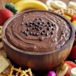To make the best brownie batter dip, you will need these simple ingredients: - 1 cup all-purpose flour (heat-treated) - 1/2 cup unsweetened cocoa powder - 1 cup brown sugar, packed - 1/2 cup granulated sugar - 1/2 cup unsalted butter, softened - 1 teaspoon vanilla extract - 1/4 teaspoon salt - 1/2 cup cream cheese, softened - 2 tablespoons milk (or more for desired consistency) - 1/2 cup mini chocolate chips Each ingredient plays a key role in giving the dip its rich, sweet flavor. The heat-treated flour ensures safety while still giving that classic brownie taste. Cocoa powder adds depth, while the sugars create the perfect sweetness. Cream cheese makes it creamy and smooth. Mini chocolate chips provide delightful bursts of chocolate. Gather these items together to create a fun and tasty treat. You will love how easy this recipe is! - Mixing the base Start by taking a mixing bowl. Add softened butter, cream cheese, and both sugars. Use an electric mixer to beat until smooth and creamy. - Incorporating dry ingredients In a separate bowl, whisk together heat-treated flour, cocoa powder, and salt. Gradually add this dry mix to your creamy base. Keep the mixer on low speed and mix until just combined. - Achieving desired consistency Pour in two tablespoons of milk. If you want a smoother dip, add more milk slowly. Mix until the dip is perfectly smooth. - Adding chocolate chips Gently fold in mini chocolate chips. This adds little bursts of chocolate in every bite. - Transferring to serving bowl Carefully transfer the brownie batter dip into a serving bowl. Make sure it looks nice for your guests. - Optional garnishing ideas For a fun touch, sprinkle more mini chocolate chips on top. You can also add colorful sprinkles or a drizzle of chocolate sauce for extra flair. How to heat-treat flour safely To heat-treat flour, spread it on a baking sheet. Bake at 350°F for five minutes. This kills any harmful bacteria and makes it safe to eat raw. Let it cool before using it in your dip. Ensuring perfect creaminess Use softened butter and cream cheese for the best results. Mixing them together first helps create a smooth base. Beat them until fully combined before adding other ingredients. This step is key for that rich, creamy texture you want in your dip. Dippables to pair with the dip This dip pairs well with many dippables. Use pretzels for a salty crunch. Fresh strawberries add a nice fruity touch. Banana slices bring sweetness, while graham crackers offer a classic flavor. Consider offering a mix for everyone to enjoy. Presentation tips for gatherings Serve your dip in a nice bowl to make it look inviting. For a fun twist, sprinkle extra mini chocolate chips on top. You can also arrange dippables around the bowl for a colorful display. This makes it easy for guests to grab their favorites while enjoying the dip! {{image_2}} You can change the flavor of your brownie batter dip with simple tweaks. First, try adding extracts like almond or mint. Just a teaspoon can make a big difference. You can also use spices like cinnamon or nutmeg for warmth. These small changes bring new life to your dip. Next, consider using different types of chocolate. You can swap out the cocoa powder for dark chocolate or even white chocolate. Each choice gives a unique twist to the flavor. Mixing flavors can lead to fun surprises and keep your dip exciting! Mix-ins can enhance your brownie batter dip. Nuts like walnuts or pecans add a nice crunch. You can chop them up and fold them in gently. If you prefer fruit, try adding mini marshmallows or diced strawberries. These add sweetness and freshness. Alternative toppings can also take your dip to the next level. Drizzle caramel or chocolate sauce on top before serving. You can even sprinkle crushed cookies or sprinkles for color. These additions make your dip look great and taste amazing! To keep your brownie batter dip fresh, store it in an airtight container. This helps prevent it from drying out. Place it in the fridge right after serving. The dip stays tasty for up to five days. Check for any changes in smell or texture before using it again. If you want to save your dip for later, freezing is a great option. Scoop the dip into a freezer-safe container. Seal it tightly to avoid freezer burn. You can freeze it for up to three months. When you’re ready to enjoy it, let it thaw in the fridge overnight. To reheat, simply stir it gently until it’s smooth again. If it seems too thick, add a splash of milk to get the right consistency. Enjoy your delicious dip again! Is Brownie Batter Dip safe to eat raw? Yes, this dip is safe to eat raw. We heat-treat the flour to kill any germs. You can enjoy it without worry. Can I make this dip ahead of time? You can make this dip ahead of time. Just store it in the fridge. It tastes great after chilling for a bit. What can I serve with Brownie Batter Dip? Serve this dip with fun dippables! Try pretzels, fresh strawberries, banana slices, or graham crackers. They all add a tasty crunch. Can I substitute ingredients? Yes, you can substitute some ingredients. Use coconut oil instead of butter. You can also try different sugars or gluten-free flour. How to adjust the sweetness or thickness? To adjust sweetness, add more sugar or cocoa powder. For thickness, add more milk until you reach the right consistency. You can find the full recipe for Decadent Brownie Batter Dip [here](#). - 1 cup all-purpose flour (heat-treated) - 1/2 cup unsweetened cocoa powder - 1 cup brown sugar, packed - 1/2 cup granulated sugar - 1/2 cup unsalted butter, softened - 1 teaspoon vanilla extract - 1/4 teaspoon salt - 1/2 cup cream cheese, softened - 2 tablespoons milk (or more for desired consistency) - 1/2 cup mini chocolate chips This dip is so easy to make! You just mix some simple ingredients. Start with softened butter and cream cheese. Add both sugars and beat them together until smooth. This gives your dip a nice creamy base. Next, mix in vanilla extract. This adds a lovely flavor that pairs well with chocolate. In another bowl, whisk the heat-treated flour, cocoa powder, and salt. Mixing these dry ingredients separately helps ensure even mixing later. Now, slowly add the dry mix to your creamy base. Mix on low speed until just combined. Do not overmix; you want a nice texture. Add milk to reach your desired dip thickness. Some like it thick, while others prefer a smoother dip. Finally, fold in the mini chocolate chips. They add fun bursts of flavor throughout. Transfer your dip to a bowl and enjoy! You learned how to make a delicious Brownie Batter Dip. We covered the ingredients, easy steps, and great tips. You can customize it with flavors and mix-ins to fit your taste. Storing it correctly keeps it fresh for your next snack. Look back at the section on FAQs for extra help. Now, you’re ready to impress friends and family with this tasty treat! Enjoy every bite and share your new skill.
