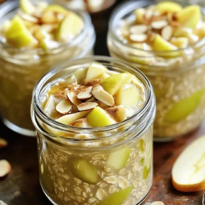 - Rolled oats - Almond milk - Diced apple - Chia seeds - Maple syrup - Ground cinnamon - Vanilla extract - Salt - Optional toppings - 1 cup rolled oats - 2 cups almond milk - 1 medium apple - 1 tablespoon chia seeds - 1 tablespoon maple syrup - 1 teaspoon ground cinnamon - 1/2 teaspoon vanilla extract - Pinch of salt Caloric content: One serving has around 300 calories. This makes it a good morning boost without too many calories. Macronutrient breakdown: - Carbs: 50 grams - Fats: 9 grams - Proteins: 9 grams Health benefits of key ingredients: - Rolled oats: Great for heart health and high in fiber. - Chia seeds: Packed with omega-3s and help in digestion. - Apples: Full of vitamins and antioxidants. - Cinnamon: May help lower blood sugar levels and adds flavor. These ingredients make Apple Cinnamon Overnight Oats not just tasty, but also a smart choice for breakfast. You can find the full recipe to get started right away! - In a medium bowl, combine the rolled oats, almond milk, chia seeds, maple syrup, ground cinnamon, vanilla extract, and a pinch of salt. Stir the mixture well. - Next, gently fold in the diced apple. Make sure it's spread evenly throughout the mixture. - Divide the mixture into two jars or any container you have. This makes it easy to grab in the morning. - Refrigerate the jars overnight or for at least 6 hours. This soaking time is key. - Soaking the oats helps them absorb the milk. It also allows the flavors to blend nicely. - In the morning, take out the jars and give the oats a good stir. If they seem too thick, add a splash of almond milk. - Before serving, top each jar with sliced almonds, more apple slices, and a sprinkle of cinnamon. This adds extra flavor and crunch. For the complete details, check the Full Recipe. To get the perfect texture for your overnight oats, you can adjust the liquid. For thicker oats, use less almond milk. If you prefer a creamier mix, add more. You should soak your oats for at least six hours. This helps them absorb the flavors and get soft. Overnight is best for full flavor. You can add extra spices to boost the flavor. Nutmeg or ginger pairs well with cinnamon. For apples, Granny Smith is a great choice. Their tartness balances the sweetness of maple syrup. You can also try Honeycrisp or Fuji apples for a sweeter option. Serving your oats in clear jars makes them look yummy. You can layer the oats and apples for a fun look. Top them with sliced almonds, more apple slices, or a sprinkle of cinnamon. Drizzling a bit of maple syrup on top adds a nice touch. It makes your breakfast not just tasty, but beautiful too! {{image_2}} You can use many types of milk for your oats. Almond milk works great, but you might try oat, soy, or coconut milk too. Each milk adds its own flavor. For a creamier texture, go with coconut milk. If you want something light, oat milk is perfect. Soy milk adds protein, making your oats even more filling. Get creative with your oats! You can add nuts like walnuts or almonds for crunch. Seeds such as pumpkin or sunflower seeds provide extra nutrients. Fresh fruits like berries or bananas mix well, too. In the fall, use pumpkin puree or dried cranberries for a seasonal twist. These add-ins keep your breakfast exciting and new every day. If you like your oats sweeter, adjust the maple syrup. Start with one tablespoon, then taste. If you want more sweetness, add a bit more. You can also try honey or agave syrup. For a low-cal option, consider using stevia or monk fruit. These alternatives keep your oats tasty without too much sugar. For keeping your apple cinnamon overnight oats fresh, use airtight containers. Glass jars or plastic containers work well. They keep the oats from drying out and prevent any odors from mixing. Store them in the fridge for up to five days. This time frame ensures you enjoy the best flavor and texture. If you like your oats warm, you can easily heat them. Simply transfer the desired amount to a microwave-safe bowl. Heat for about 30 seconds to one minute, stirring halfway through. Add a splash of almond milk if they seem too thick. Can you freeze overnight oats? Yes! You can freeze them for up to three months. Use freezer-safe containers and leave some space at the top for expansion. This makes a great meal prep option. To thaw, move the container to the fridge the night before. If you're in a hurry, you can use the microwave on low power. Once thawed, stir well and adjust the texture with a splash of milk before enjoying! Yes, you can easily make these oats vegan. Just swap almond milk for any non-dairy milk you like. You can use oat milk, soy milk, or coconut milk as great options. For sweetening, maple syrup is already vegan. If you want extra creaminess, try adding a bit of coconut yogurt. You can store your overnight oats for about 3 to 5 days in the fridge. Just keep them in airtight containers. This way, they stay fresh and tasty. If you notice any change in smell or texture, it's best to toss them out. You can use instant oats, but the texture will change. Instant oats cook faster and become mushy. Rolled oats have a thicker, hearty bite. If you prefer a smoother mix, instant oats are fine. Just reduce the soaking time to about 2-4 hours instead of overnight. You can swap apples for many other fruits. Try bananas, berries, or peaches, depending on what's in season. Each fruit adds its unique taste. For example, bananas give a creamy texture, while berries pack a tangy punch. Experiment with what you like best! You now have a clear guide to making delicious Apple Cinnamon Overnight Oats. We explored the simple ingredients, measured them out, and learned about their health benefits. The step-by-step instructions make prep easy, and the tips help achieve the perfect texture and flavor. Whether you want to vary the milk or try different fruits, the options are endless. Remember to store your oats correctly for lasting freshness. Get creative and enjoy a tasty, healthy breakfast that fits your style. Your mornings will never be the same!