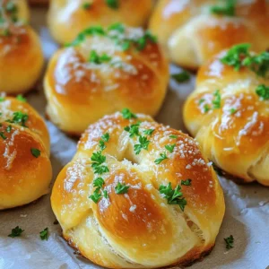 - 1 package (1.5 lbs) refrigerated pizza dough - ½ cup unsalted butter, melted - 4 cloves garlic, minced - 2 tablespoons fresh parsley, chopped - 1 teaspoon garlic powder - ½ teaspoon salt - ½ teaspoon black pepper - ½ cup grated Parmesan cheese The base of this recipe is the refrigerated pizza dough. It saves time and works perfectly. You can find it in any grocery store. The garlic and butter bring bold flavors that everyone loves. Fresh parsley adds color and freshness. Parmesan cheese gives a nice salty touch to each knot. Proper measurements are key for great results. Use a kitchen scale if you have one. This ensures each ingredient is just right. For example, use ½ cup of melted butter. If you're avoiding dairy, you can use coconut oil instead. It melts well and gives a nice flavor. Choosing the best garlic is important. Fresh garlic has a strong taste. Look for firm cloves with no brown spots. For butter, use unsalted to control the salt in your dish. It helps the flavors shine. When picking pizza dough, choose brands that are fresh. Store-bought is fine, but some local bakeries have great options too. Always check the expiration date for the best quality. To start, gather all the tools you need. You will want: - A baking sheet - Parchment paper - A rolling pin - A knife or pizza cutter - A small saucepan - A brush for butter Next, prepare your workspace. Lightly flour your counter or table. This keeps the dough from sticking. Open your package of refrigerated pizza dough. Roll it out into a rectangle about 1/4-inch thick. This makes it easier to cut and shape. Now it’s time to form the knots. Slice the dough into strips that are about 1 inch wide. Each strip should be long enough to tie into a knot. Grab one strip and tie it into a knot. Pull the ends through to tighten it. Place the knot on your baking sheet. Repeat this step until all strips are tied. For even sizing, try to keep all strips the same width. Set your oven to 375°F (190°C) and let it preheat. Line your baking sheet with parchment paper for easy cleanup. Bake the knots for 15-20 minutes. Look for a golden brown color. When they are done, they should smell amazing! If you want extra flavor, brush some leftover garlic butter on top right after removing them from the oven. You can boost the flavor of your garlic butter knots. Try adding spices like red pepper flakes or Italian herbs for extra zing. You can also mix in some grated cheese into the dough for a cheesy twist. Pair these knots with dips like marinara or ranch for a fun snack. Each dip adds a new layer of taste. For gatherings, serve your garlic butter knots in a large basket lined with a colorful cloth. This makes them look inviting. You can also drizzle some extra garlic butter on top for shine. For plating, arrange knots in a circle on a platter. Add a small bowl of dip in the center for a nice touch. To keep your garlic butter knots fluffy, don’t roll the dough too thin. Aim for about 1/4-inch thickness. Also, bake them just until golden brown. Over-baking can make them hard. If you notice them getting too brown, cover them with foil for the last few minutes. This helps trap moisture and keeps them soft. {{image_2}} You can use different types of dough for garlic butter knots. Whole wheat dough adds a nutty flavor. It also makes the knots a bit healthier. If you need gluten-free options, look for gluten-free pizza dough. Many stores sell it now. You can also make your own if you prefer. Flavor-infused dough adds a twist. Try adding herbs or spices to the dough. This makes the knots even more tasty. Changing the seasonings can really change the flavor. Garlic herb blends work great. Mix garlic powder with Italian herbs like oregano and basil. This adds a nice touch. You can also experiment with cheese variations. Try adding different cheeses to the butter mix. Mozzarella or cheddar can give a rich taste. Just sprinkle them on top before baking for a cheesy finish. Stuffing your knots is a fun way to add surprise flavors. You can fill them with cheese or pesto. To stuff the knots, flatten the dough strips a bit. Place your filling in the center and then tie the knots. Make sure to seal them well so the filling stays inside. Baking them this way keeps the filling warm and melty. It’s a great way to surprise your guests with every bite! To keep your garlic butter knots fresh, wrap them tightly in plastic wrap or foil. You can also place them in an airtight container. This way, they won’t dry out. Store them in the fridge for up to three days. If you want to keep them longer, freezing is a great option. To reheat your knots, use an oven for the best results. Preheat the oven to 350°F (175°C). Place the knots on a baking sheet and heat for about 5-10 minutes. This keeps them crispy. If you use a microwave, the knots may become soft. Heat them for about 10-15 seconds. Check to see if they are warm enough. To freeze garlic butter knots, first, let them cool completely. Then, place them in a freezer-safe bag or container. Make sure to remove as much air as possible. They can last in the freezer for up to three months. When you're ready to eat, thaw them in the fridge overnight before reheating. This keeps their taste and texture just right. Yes, you can prepare the dough ahead of time. Just roll it out and cut it into strips. Store the strips in the fridge, covered, for up to 24 hours. When you're ready, tie them into knots and bake them fresh! You can use homemade dough for these knots. Just ensure the dough is similar in texture to pizza dough. This way, your knots will still turn out fluffy and soft. Homemade dough might add a personal touch to the snack. Garlic butter knots pair well with many dishes. Here are some great options: - Marinara sauce for dipping - A fresh side salad - Soup, like tomato or minestrone - Cheese platter You can make garlic butter using garlic powder. Mix ½ teaspoon of garlic powder with melted butter. You can also add a pinch of onion powder for more flavor. This method is quick and still gives great taste. Yes, you can make these knots dairy-free. Use plant-based butter instead of regular butter. There are many good options available now. Just remember to check the cheese and use a dairy-free version if you want to keep it all dairy-free. You now know how to make delicious garlic butter knots with ease. We discussed key ingredients, preparation steps, and handy tips for perfect results. Don't forget to try different dough options and flavorings for variety. Enjoy your knots fresh or stored for later. Use these techniques to impress at your next gathering. With practice, you’ll master this tasty treat. Share your success and enjoy every bite!