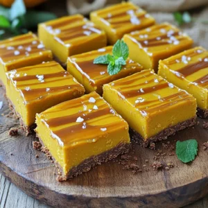 To make these delicious bars, you will need the following ingredients: - 1½ cups graham cracker crumbs - ½ cup unsweetened cocoa powder - ½ cup unsalted butter, melted - ½ cup brown sugar, packed - 1 cup canned pumpkin puree - ½ teaspoon ground cinnamon - ¼ teaspoon ground nutmeg - ¼ teaspoon ground ginger - 1 cup cream cheese, softened - ½ cup powdered sugar - 1 teaspoon vanilla extract - ½ cup caramel sauce (store-bought or homemade) - Sea salt flakes for garnish Quality matters when you cook. Fresh, high-quality ingredients make a big difference. For the graham cracker crumbs, I recommend using whole graham crackers instead of pre-packaged crumbs for better flavor. If you can find organic cocoa powder, it will elevate the taste of your bars. You can swap brown sugar with coconut sugar for a deeper flavor. If you prefer a lighter filling, use low-fat cream cheese. For the pumpkin puree, look for brands without added sugars or preservatives. Choosing the right pumpkin puree can change your dish. Canned pumpkin is easy and reliable. Look for brands like Libby's or Farmer's Market. They offer consistent quality. If you want to try homemade, roast fresh pumpkins, scoop out the flesh, and blend until smooth. For caramel sauce, I suggest brands like Ghirardelli or Smucker's. They have great flavors and textures. If you want a fun twist, try making your own caramel sauce. It’s simple and adds a personal touch to your bars. To start, gather your ingredients for the crust. In a medium bowl, mix together 1½ cups of graham cracker crumbs, ½ cup of unsweetened cocoa powder, ½ cup of melted unsalted butter, and ½ cup of packed brown sugar. Stir until the mixture looks crumbly and well mixed. Next, grab a 9x9-inch baking dish. Press the crumbly mixture evenly into the bottom of the dish. I use the back of a measuring cup to get a nice flat surface. Then, place the dish in the fridge while you work on the filling. Now, let's make the pumpkin filling. In a large bowl, combine 1 cup of canned pumpkin puree with ½ teaspoon of ground cinnamon, ¼ teaspoon of ground nutmeg, and ¼ teaspoon of ground ginger. Mix until everything is fully combined. In another bowl, beat 1 cup of softened cream cheese with an electric mixer. Mix until smooth. Gradually add in ½ cup of powdered sugar and 1 teaspoon of vanilla extract. Keep mixing until the mixture is creamy and well blended. Finally, fold the pumpkin mixture into the cream cheese mixture. Be gentle to keep it fluffy. It's time to put it all together! Take the crust from the fridge and spread the pumpkin cream cheese filling evenly over it. Use a spatula to smooth out the top. Next, drizzle ½ cup of caramel sauce over the pumpkin filling. Use a knife to swirl the caramel gently around for a marbled look. After that, sprinkle a few sea salt flakes on top to enhance the flavors. Cover the dish with plastic wrap and refrigerate for at least 4 hours. This helps the bars set up nicely. Once they are set, you can cut them into bars and serve chilled. Enjoy! To avoid lumps in the filling, mix the pumpkin puree well first. Use a whisk to blend the spices in before adding the cream cheese. Beat the cream cheese until smooth, then add the powdered sugar slowly. This helps keep the mixture creamy. Always fold the pumpkin mix in gently to prevent air bubbles. Chill the bars for at least four hours. This allows the filling to set properly. If you can, let them chill overnight for best results. Keep the bars covered to avoid drying out. The longer they chill, the better the flavors meld together. For a beautiful presentation, serve the bars on a nice platter. Drizzle extra caramel sauce on top before serving. Add small sprigs of mint for a pop of color. Cut the bars neatly to show off the layers. This makes them look as good as they taste! {{image_2}} You can easily change the flavor of these bars. Here are some fun ideas: - Chocolate Chips: Fold in some mini chocolate chips for a sweet twist. - Nutmeg: Add more nutmeg for a warm, spicy taste. - Maple Syrup: Swap some caramel for maple syrup for a unique flavor. - Chopped Nuts: Pecans or walnuts can add a nice crunch. Feel free to experiment! Mixing these add-ins makes each batch special. You can make these bars fit different diets too. Try these options: - Gluten-Free: Use gluten-free graham crackers or almond flour. This keeps the crust tasty and safe. - Dairy-Free: Replace cream cheese with a dairy-free version. Coconut cream works great. - Healthier Alternatives: Use honey instead of brown sugar. This cuts down on refined sugars. These swaps still keep the bars delicious while fitting your needs! To keep your no-bake salted caramel pumpkin bars fresh, store them in the fridge. Use an airtight container to protect them from air and moisture. If you have leftovers, cut the bars into squares before storing. This makes it easy to grab a piece later! You can freeze these bars for later enjoyment. First, let the bars chill in the fridge until set. Then, cut them into squares. Wrap each square in plastic wrap or foil. Place them in a freezer bag or container. When you want to eat one, take it out and let it thaw in the fridge for a few hours. These delicious bars will last about 5 days in the fridge. If you freeze them, they can stay good for up to 2 months. Just remember to label your containers with the date you made them! Yes, you can use fresh pumpkin. You need to cook and puree it first. Fresh pumpkin gives a great taste and texture. However, canned pumpkin is easier and saves time. Both options work well in these bars. The bars need to chill for at least 4 hours. This allows them to firm up nicely. I recommend chilling them overnight for the best results. The longer they sit, the better the flavors blend. Absolutely! These bars are perfect for making ahead. You can prepare them a day or two in advance. Just store them in the fridge covered. This makes them a great treat for gatherings or special events. You now have everything you need to make no-bake salted caramel pumpkin bars. Remember the importance of choosing quality ingredients, like fresh pumpkin and a good caramel sauce. Follow the step-by-step instructions carefully, and consider the tips for a perfect texture. These bars are not only delicious but also customizable. They store well, so you can enjoy them later. Don't hesitate to try different flavors or dietary swaps. With these tips, I believe you will create a treat everyone will love. Enjoy your baking!