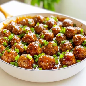 - 1 pound ground beef or turkey - 1/2 cup breadcrumbs - 1/4 cup grated Parmesan cheese - 1 egg - 2 cloves garlic, minced For this dish, I love using ground beef or turkey. Both options make tender meatballs. Breadcrumbs add the right texture. Grated Parmesan gives a nice flavor boost. The egg helps bind everything together. Minced garlic adds a wonderful aroma and taste. - 1 teaspoon onion powder - 1 teaspoon salt - 1/2 teaspoon black pepper - 1/4 teaspoon red pepper flakes (optional) - 1/3 cup honey - 1/4 cup soy sauce or tamari The seasonings can change the taste of your meatballs. Use onion powder for depth. Salt and black pepper enhance all flavors. If you like heat, add red pepper flakes. Honey makes the sauce sweet, while soy sauce or tamari gives it umami. - 1 tablespoon apple cider vinegar - 1 tablespoon cornstarch - 1 tablespoon sesame oil - 2 green onions, chopped - Sesame seeds Garnishes are key to finishing this dish. Apple cider vinegar adds brightness. Cornstarch thickens the sauce, making it stick to the meatballs. Sesame oil brings a nutty flavor. Green onions and sesame seeds not only look great but also add crunch. Start by mixing the meatball ingredients. In a large bowl, add: - 1 pound ground beef (or turkey) - 1/2 cup breadcrumbs - 1/4 cup grated Parmesan cheese - 1 egg - 2 cloves garlic, minced - 1 teaspoon onion powder - 1 teaspoon salt - 1/2 teaspoon black pepper - 1/4 teaspoon red pepper flakes (optional) Use your hands to combine everything until it’s just mixed. Do not overwork the mixture; this keeps the meatballs tender. Next, shape the mixture into small meatballs, about 1 inch in diameter. This size helps them cook evenly. Place the meatballs on a plate and set them aside while you heat the skillet. In a large skillet, heat 1 tablespoon of sesame oil over medium heat. Once the oil is hot, add the meatballs in a single layer. It’s best not to crowd them. Cook for about 6-8 minutes. Turn the meatballs occasionally to brown them on all sides. You want them to be cooked through, reaching an internal temperature of 165°F (74°C). While the meatballs cook, make the honey garlic sauce. In a small bowl, whisk together: - 1/3 cup honey - 1/4 cup soy sauce (or tamari for gluten-free) - 1 tablespoon apple cider vinegar - 1 tablespoon cornstarch This mix will add a sweet and savory flavor. Once the meatballs are browned and cooked, pour the sauce over them in the skillet. Stir gently to coat each meatball in the sauce. Let it simmer for 2-3 minutes. This allows the sauce to thicken slightly and cling to the meatballs. Garnish your dish with chopped green onions and sesame seeds. Serve hot and enjoy! To make great meatballs, avoid overworking the mixture. Mix just until combined. If you overmix, your meatballs can become tough. For even cooking, shape your meatballs into uniform sizes. Aim for about one inch in diameter. This helps them cook at the same rate. If you want a thicker sauce, add more cornstarch. Mix it well with a little water first. This will help it blend into the sauce smoothly. Balancing flavors is key. Taste your sauce as you cook. If it's too sweet, add a bit more soy sauce. If it’s too salty, add extra honey to balance it out. Serve your meatballs over steamed rice or quinoa. This adds a nice base and makes it a full meal. For a rustic look, keep the meatballs in the skillet. Garnish them with chopped green onions and sesame seeds. This adds color and makes the dish more appealing. {{image_2}} You can swap ground beef for ground turkey or chicken. These meats are leaner and still tasty. Ground turkey brings a mild flavor that blends well with the sauce. You can also use plant-based meat for a vegetarian option. Many brands make great alternatives. They still give you that hearty texture with fewer calories. If you need gluten-free options, replace regular breadcrumbs with gluten-free ones. You can find these in most grocery stores. They work just as well for binding the meatballs. For the sauce, use tamari instead of soy sauce. Tamari has a similar taste but is gluten-free. This way, everyone can enjoy the dish without worry. To boost the flavor, add fresh herbs like ginger or cilantro. Ginger gives a warm spice, while cilantro adds a fresh taste. You can also mix in finely chopped vegetables. Carrots or bell peppers are great choices. They add texture and nutrition without changing the meatball's flavor too much. These little changes can make your dish exciting and unique. To keep your honey garlic meatballs fresh, store them in the fridge. Place them in a container with a tight seal. They will stay good for about 3 to 4 days. Make sure the meatballs are cool before you put them away. This helps prevent moisture buildup. I recommend using glass containers. They help you see what’s inside and are safe for reheating. If you want to keep meatballs longer, freezing is a great option. First, let them cool completely. Then, lay them out on a baking sheet. Freeze them for about 1 hour. Once frozen, put them in a freezer bag. Squeeze out extra air to avoid freezer burn. They can last up to 3 months in the freezer. When you're ready to eat, thaw them in the fridge overnight for best results. Reheating meatballs is easy, and you have several options. You can use the microwave, oven, or stovetop. For the microwave, place meatballs in a bowl and cover them. Heat in 30-second intervals until hot. If you prefer the oven, place meatballs on a baking sheet at 350°F for about 10-15 minutes. For stovetop, add them to a skillet with a splash of water or sauce. Heat on low, stirring gently. This method keeps the sauce flavorful and prevents it from drying out. Honey garlic meatballs last about 3 to 4 days in the fridge. To keep them fresh, store them in an airtight container. Signs of spoilage include a bad smell, mold, or a change in color. If you see any of these, it's best to toss them. Yes, you can make meatballs ahead of time! You can mix the meatball ingredients and shape them into balls. Store them in the fridge for up to a day before cooking. This saves time on busy nights. If you want to, you can also cook them and store them for later. Just reheat them before serving. You have many options for side dishes. Steamed rice or quinoa pairs nicely. You can also serve them with a fresh salad or stir-fried veggies for a balanced meal. For a fun twist, try serving them in lettuce wraps. They make a great appetizer or snack too! You’ve learned how to make delicious honey garlic meatballs, from choosing your ingredients to cooking them perfectly. We covered variations for different diets and tips for storing leftovers. Remember, the magic is in balancing flavors and enjoying every bite. Experimenting with herbs or veggies can make your dish unique. Whether it’s for dinner or meal prep, these meatballs will be a hit. Enjoy this simple recipe, and get creative in your kitchen!