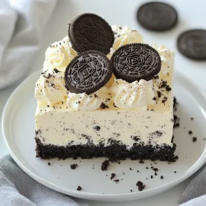 - 24 Oreo cookies (for crust and garnish) - 1/2 cup unsalted butter, melted - 16 oz cream cheese, softened - 1/2 cup powdered sugar - 1 teaspoon vanilla extract - 2 cups heavy whipping cream - 1/4 cup Oreo crumbs Gathering the right ingredients is key to a great no bake Oreo cheesecake. The star of this recipe is the Oreo cookies. You need 24 cookies for both the crust and the garnish. They provide a rich chocolate flavor that blends well with the creamy filling. You'll also need 1/2 cup of unsalted butter. Melt it to help bind the Oreo crumbs into a solid crust. Next, grab 16 ounces of softened cream cheese. This gives the cheesecake its creamy texture. For sweetness, use 1/2 cup of powdered sugar. It blends smoothly into the cream cheese. Add 1 teaspoon of vanilla extract for warmth and flavor depth. Whipping cream is important too. Use 2 cups of heavy whipping cream. Whipping it adds lightness to the filling. Finally, save 1/4 cup of Oreo crumbs. These crumbs add a nice texture and layer of flavor. Make sure you have all these ingredients ready to go. This will help the process flow smoothly and ensure you create a delicious no bake Oreo cheesecake! {{ingredient_image_1}} 1. Crushing Oreo cookies: Start by taking 24 Oreo cookies. Place them in a food processor. Pulse until they turn into fine crumbs. 2. Combining with melted butter: In a bowl, mix the Oreo crumbs with 1/2 cup of melted butter. Stir until all the crumbs are coated and stick together. 3. Pressing into a springform pan: Take a 9-inch springform pan. Firmly press the Oreo mixture into the bottom. Use the back of a measuring cup to smooth it out. Chill this crust in the fridge while you make the filling. 1. Beating cream cheese: In a large bowl, take 16 oz of softened cream cheese. Use an electric mixer to beat it until it’s creamy and smooth. 2. Incorporating powdered sugar and vanilla: Gradually add in 1/2 cup of powdered sugar and 1 teaspoon of vanilla extract. Mix until everything is well blended. 3. Whipping heavy cream to stiff peaks: In another bowl, pour in 2 cups of heavy whipping cream. Beat this with an electric mixer until stiff peaks form. This takes about 3-5 minutes. 1. Folding whipped cream into cream cheese mixture: Gently fold the whipped cream into the cream cheese mix. Keep folding until you no longer see white streaks. 2. Adding Oreo crumbs: Fold in 1/4 cup of Oreo crumbs. Make sure they are evenly mixed throughout the filling. 3. Filling the crust and smoothing the top: Pour the cheesecake filling into the chilled crust. Use a spatula to smooth the top evenly. 1. Covering and refrigerating: Cover the cheesecake with plastic wrap. Place it in the fridge for at least 4 hours to set. For best results, chill it overnight. 2. Removing from the springform pan: When set, carefully remove the sides of the springform pan. 3. Garnishing before serving: Before serving, sprinkle some crushed Oreo cookies or place whole ones on top for a nice look. Enjoy your rich and creamy no-bake Oreo cheesecake! - Ensure cream cheese is softened: Softened cream cheese mixes better. Leave it out for an hour before starting. This helps create a smooth filling. - Gently fold whipped cream: When you add the whipped cream to the cream cheese, fold carefully. This keeps the mixture light and fluffy. Use a spatula and a gentle motion. - Overmixing the cream: If you mix too much, the cream can lose its air. This can lead to a dense cheesecake. Stop mixing as soon as you see no white streaks. - Not chilling long enough: Chilling is key for the cheesecake to set. Aim for at least four hours. Overnight is best for a firm and creamy texture. - Best tools for making cheesecake: A good electric mixer is a must for the cream cheese. A food processor makes crushing Oreos easy. You also need a 9-inch springform pan to hold everything. - Using a food processor effectively: When crushing cookies, pulse them in short bursts. This helps you get fine crumbs without making a mess. It saves time and effort in the kitchen. Pro Tips Use Room Temperature Ingredients: Make sure your cream cheese is at room temperature for a smoother filling without lumps. Chill the Cheesecake Overnight: For the best texture and flavor, allow the cheesecake to set overnight in the refrigerator. Experiment with Flavors: Add a tablespoon of chocolate or caramel sauce to your filling for an extra layer of flavor. Garnish Creatively: Top your cheesecake with whipped cream, chocolate shavings, or a drizzle of chocolate sauce for a stunning presentation. {{image_2}} You can change the flavor easily. Adding chocolate or vanilla extracts makes it fun. Just one teaspoon can change the taste. You can also swap the Oreo cookies. Try different cookie brands for a new twist. For example, use chocolate mint cookies or peanut butter cookies. Each cookie brings a unique taste, making your cheesecake special. If you need gluten-free options, use gluten-free cookies. Many brands make gluten-free Oreos. You can also create a vegan version. Replace the cream cheese with a dairy-free option. Use coconut cream or vegan cream cheese. For the heavy cream, use coconut whipping cream. These swaps keep the cheesecake rich and delicious without dairy. Serving the cheesecake with fruit adds freshness. Berries like strawberries, raspberries, or blueberries work well. You can also drizzle chocolate sauce on top. This adds a nice touch to each slice. For plating, try using a cake stand for height. Place a few whole Oreos on top for fun. You can even add a sprinkle of Oreo crumbs for a crunchy look. To keep your cheesecake fresh, store it in the fridge. Cover it well with plastic wrap. Alternatively, use an airtight container. This will prevent it from absorbing smells and drying out. Your cheesecake stays good for about 3 to 5 days in the fridge. Freezing your no bake Oreo cheesecake is simple. First, let it chill completely in the fridge. Then, carefully wrap the cheesecake in plastic wrap. After that, place it in a freezer-safe container. This helps keep the cheesecake fresh for up to a month. To thaw, move it to the fridge the night before you want to serve it. This slow thaw keeps the texture nice. Avoid defrosting it at room temperature, as this can make it mushy. The cheesecake needs at least 4 hours to chill. For the best results, leave it overnight. This helps the filling firm up well. It also allows the flavors to blend perfectly. Yes, you can easily make this cheesecake ahead of time. I recommend preparing it a day before you need it. Store it covered in the fridge. This way, it stays fresh. Just remember to add any toppings just before serving. You can use low-fat cream cheese, but it may change the taste and texture. The cheesecake might not be as rich and creamy. If you want a lighter option, it’s worth a try. Just keep in mind that the flavor will differ slightly. You can get creative with toppings! Here are some ideas: - Crushed Oreos for a crunchy layer - Whipped cream for a light touch - Chocolate sauce for added sweetness - Fresh berries for a fruity twist Feel free to mix and match as you like! In this article, we explored how to make a delicious no-bake Oreo cheesecake. We covered all the ingredients needed, from Oreo cookies to cream cheese. You learned step-by-step instructions to create the crust, filling, and how to chill it perfectly. I shared tips for a perfect cheesecake and common mistakes to avoid. You can customize flavors and store leftovers effectively. This cheesecake is fun to make and always a hit. Enjoy creating it for your next gathering!