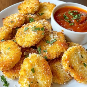 - 1 lb chicken breast, cut into bite-sized pieces - 1 cup all-purpose flour - 2 large eggs, beaten - 1 cup breadcrumbs (preferably panko for extra crunch) - 1/2 cup grated Parmesan cheese - 4 cloves garlic, minced - 1 teaspoon dried oregano - 1 teaspoon paprika - Salt and pepper to taste - Olive oil spray - Parchment paper Gathering these ingredients is easy. You can find chicken breast at any store. Panko breadcrumbs give a great crunch. Grated Parmesan adds a sharp taste. Fresh garlic brings out the best flavor. The spices enhance everything, making each bite special. Parchment paper helps the nuggets bake without sticking. Olive oil spray keeps them crispy without adding too much fat. Using these fresh and simple ingredients makes this snack a favorite. You can easily adjust the spices to fit your taste. Want it spicier? Add some cayenne pepper. Prefer more cheese flavor? Toss in extra Parmesan. Cooking should be fun, and these nuggets let you explore. {{ingredient_image_1}} First, you need to preheat your oven to 400°F (200°C). This step is key for a nice, crispy texture. Next, line a baking sheet with parchment paper. This will stop the nuggets from sticking. Now, let’s mix the ingredients. In a shallow dish, combine 1 cup of all-purpose flour with a pinch of salt and pepper. In another shallow dish, beat 2 large eggs. In a third shallow dish, mix 1 cup of breadcrumbs, 1/2 cup of grated Parmesan cheese, 4 minced garlic cloves, 1 teaspoon of dried oregano, and 1 teaspoon of paprika. This mix brings great flavor! It’s time to coat the chicken! Start by dipping each piece into the flour mixture. Make sure to coat it well. After that, shake off any excess flour. Next, dip the chicken into the beaten eggs. Allow any extra egg to drip off. Finally, coat the chicken with the breadcrumb mixture. Press gently to make sure it sticks well. This step is important for that crunchy texture. Place the coated nuggets on your baking sheet. If you want, lightly spray the tops with olive oil. This helps them get even crispier in the oven. Now, let’s bake! Place the baking sheet in the preheated oven. Bake the chicken nuggets for 15 to 20 minutes. They should turn golden brown and be fully cooked. Halfway through, flip the nuggets for even cooking. This ensures each side gets that perfect crunch. Once baked, let them rest for a minute before serving. This helps them stay juicy inside. Enjoy your tasty garlic Parmesan chicken nuggets! To get that perfect crunch, I always choose panko breadcrumbs instead of regular ones. Panko is lighter and crispier, which makes your nuggets extra crunchy. When you coat your chicken, spray a bit of olive oil on top. This helps achieve that golden color and crispiness. The oil brings out the best in the breadcrumbs. Want to spice things up? You can add other herbs or spices to the breadcrumb mix. Try some Italian seasoning, garlic powder, or even a touch of cayenne for heat. These additions will take your nuggets to the next level. For dips, I love serving them with marinara or garlic aioli. Both pair well with the garlic and cheese flavor. You can choose to bake or fry your nuggets. Baking is great if you want a healthier option. Just remember to flip them halfway through cooking. If you prefer frying, use a pan with hot oil for a crispy finish. Air fryers are another fantastic choice. They cook the nuggets quickly and keep them crispy without much oil. Pro Tips Use Fresh Garlic: Freshly minced garlic gives a robust flavor that powdered garlic cannot replicate. Make sure to use fresh cloves for the best taste! Double-Dip for Extra Crunch: For an even crunchier texture, dip the chicken nuggets in the egg mixture twice before coating them in breadcrumbs. Experiment with Seasonings: Feel free to customize your breadcrumb mixture with different herbs and spices like Italian seasoning or cayenne pepper for a kick! Let Them Rest: Allowing the baked nuggets to rest for a couple of minutes after cooking will help them retain their juiciness and make them easier to handle. {{image_2}} You can switch up the protein in your nuggets. Use chicken thighs or tenders instead of breast. Chicken thighs are juicier and add great flavor. Tenders also stay moist and cook quickly. You can also try turkey nuggets. They offer a leaner option with similar taste. For a plant-based choice, look for veggie or tofu nuggets. They absorb flavors well and make a tasty alternative. Change the cheese for a fun twist. Try cheddar for a sharper taste. Mozzarella gives a milder, creamy flavor. Adjust the garlic to suit your taste. Use less for a subtle hint or more for a bold kick. You can even swap fresh garlic for garlic powder. This makes it easier and just as tasty. Pair these nuggets with different sauces. BBQ sauce adds a nice sweetness. Ranch dressing is creamy and cool. You can also try garlic aioli for a rich flavor. Serve with fresh veggies like carrot sticks or a crisp salad. The crunch of veggies balances the hearty nuggets. This makes for a fun and healthy snack or meal. To store leftover chicken nuggets, place them in an airtight container. Make sure they cool down first. You can keep them in the fridge for up to three days. It is best to eat them within this time for the best taste and texture. For freezing, let the nuggets cool completely. Then, place them in a freezer-safe bag. Remove as much air as possible before sealing. You can freeze them for up to three months. When you want to eat them, take them out and let them thaw overnight in the fridge. You can reheat the nuggets in an oven, microwave, or air fryer. For the oven, preheat it to 375°F (190°C). Bake for about 10-12 minutes until crispy. In the microwave, heat for about 1-2 minutes. But be careful, as this can make them soggy. The air fryer is a great option too. Set it to 375°F (190°C) and cook for about 5-7 minutes. This method keeps them crunchy and delicious. To make these nuggets crispy, focus on the coating and oil. Use panko breadcrumbs instead of regular ones. Panko gives that extra crunch you want. When you coat the chicken, make sure to shake off any extra flour. This helps the egg and breadcrumbs stick better. Lightly spray the tops with olive oil before baking. This gives them a nice golden color and a crispy texture. Bake them at 400°F for 15-20 minutes. Flip them halfway through for even cooking. Yes, you can prepare the nuggets in advance. If you want to store them, place the uncooked nuggets in an airtight container. They can stay in the fridge for up to 24 hours. You can also freeze them for longer storage. Just lay the coated nuggets on a baking sheet and freeze until solid. Then, transfer them to a zip-top bag. When you’re ready to cook, bake them directly from the freezer. Just add a few extra minutes to the cooking time. These chicken nuggets taste great with many dipping sauces. Marinara sauce is a classic choice and adds a nice tang. Garlic aioli brings a creamy, rich flavor that complements the garlic in the nuggets. You can also try ranch dressing for a cool dip or BBQ sauce for a sweet kick. Honey mustard is another fun option that pairs well with the savory notes of the chicken. Feel free to mix and match to find your favorite! You learned how to make Garlic Parmesan Chicken Nuggets with simple steps. We covered ingredients, cooking methods, and storage tips. You can achieve crispy nuggets by coating them well and using olive oil. Remember to experiment with flavors and try different proteins. These nuggets are great with various sauces and sides. Now, you have everything you need for a tasty meal. Enjoy making this dish with your favorite variations!