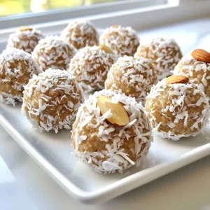 - 1 cup almond flour - 1/2 cup unsweetened shredded coconut - 1/4 cup raw honey or maple syrup - 1/4 cup almond butter - 1/2 teaspoon vanilla extract - 1/4 teaspoon salt - 1/3 cup dark chocolate chips - 1/4 cup whole almonds (for topping) To make Almond Joy Protein Balls, gather these simple ingredients. Almond flour forms the base and gives a nutty flavor. Unsweetened shredded coconut adds texture and a tropical touch. Choose either raw honey or maple syrup for sweetness. Almond butter binds it all together and adds creaminess. Vanilla extract enhances the taste. A pinch of salt balances the sweetness and brings out the flavors. Dark chocolate chips offer a rich chocolate flavor, making these bites irresistible. Finally, whole almonds on top give a crunchy finish. These ingredients work together to create a delicious and nutritious snack. You'll love how easy it is to make these protein balls. Plus, they provide energy for your day! {{ingredient_image_1}} First, grab a large mixing bowl. Combine 1 cup of almond flour and 1/2 cup of unsweetened shredded coconut. Mix them well. Next, add 1/4 cup of raw honey or maple syrup. Then, add 1/4 cup of almond butter, 1/2 teaspoon of vanilla extract, and 1/4 teaspoon of salt. Stir until the mixture becomes sticky and dough-like. After mixing, fold in 1/3 cup of dark chocolate chips. This adds a rich flavor. Now, take about 1 tablespoon of the mixture and roll it into a ball. Place each ball on a parchment-lined baking sheet. Make sure they have space between them. To finish, press a whole almond into the top of each protein ball. This gives them a nice crunch. Once you’re done, put the baking sheet in the refrigerator. Let the balls chill for at least 30 minutes. This helps them firm up before you serve them. Enjoy your tasty Almond Joy Protein Balls! To get the best texture, mix the ingredients very well. I like to use my hands to ensure everything blends. If your mixture feels too dry, add more almond flour. If it's too sticky, you can add a bit of honey or maple syrup. Finding the right balance is key to making these treats enjoyable. You can switch up the chocolate chips to suit your taste. Try milk chocolate or even white chocolate if you prefer. If you want a richer flavor, consider using cocoa powder instead of chocolate chips. Just remember to adjust the sweetness level to match. Kids love to help in the kitchen! Get them involved in rolling the protein balls. It’s a great way to bond and have fun. You can also let them choose toppings. Try using crushed nuts, sprinkles, or even mini chocolate chips. This makes the snack more exciting for them. Pro Tips Store Properly: Keep your protein balls in an airtight container in the refrigerator to maintain freshness for up to a week. Customize Your Sweetness: Adjust the amount of honey or maple syrup based on your personal preference for sweetness. Nut Variations: Feel free to experiment with different nuts or nut butters for varied flavors and textures. Protein Boost: Add a scoop of your favorite protein powder to the mixture for an extra protein kick. {{image_2}} You can easily change the taste of your Almond Joy Protein Balls. Adding a few drops of vanilla or almond extract brings a nice twist. These simple flavors make your snack even more delightful. You might also try spices like cinnamon or nutmeg. A pinch can give your balls a warm, cozy taste. If you want to make these protein balls vegan, swap out honey for maple syrup. It works well and keeps the sweetness. For those with gluten concerns, use certified gluten-free almond flour. This way, everyone can enjoy these tasty treats without worry. Nut allergies shouldn’t keep anyone from enjoying these protein balls. You can substitute almond butter with sunflower seed butter. This swap keeps the creamy texture while being safe for all. If you need to avoid whole almonds, just leave them off. Your protein balls will still taste great without them! To keep your Almond Joy Protein Balls fresh, use an airtight container. This helps maintain their texture and taste. I recommend glass or BPA-free plastic containers. You can store them in the fridge or freezer. The fridge is best for short-term storage. The freezer works well for longer periods. Almond Joy Protein Balls last about one week in the refrigerator. Make sure to seal them well. For longer storage, freeze them. They can stay good for up to three months in the freezer. Just wrap each ball in plastic wrap or place them in a freezer bag. If you want to refresh frozen protein balls, take them out of the freezer. Let them sit at room temperature for about 15 minutes. This helps soften them. You can also warm them slightly in the microwave for a few seconds if you prefer. Enjoy your snack at your own pace! You can use natural sweeteners like stevia or monk fruit. These options add sweetness without sugar. I like to blend them with almond butter for a rich taste. This keeps your protein balls tasty and healthy. You can adjust the amount based on your taste. Yes, you can! Cashew flour or hazelnut flour works well. These flours add a unique flavor. They also keep the protein balls gluten-free. Just keep in mind that the texture may change slightly. You might need to adjust the amount based on the flour you choose. Each Almond Joy Protein Ball has about 3 grams of protein. This comes mainly from almond flour and almond butter. These ingredients not only add protein but also healthy fats. This makes them a great snack, especially after a workout. Absolutely! These protein balls are perfect for meal prep. You can make a batch and store them in the fridge. They last up to a week, making them a convenient snack. You can also freeze them for longer storage. Just let them thaw before enjoying! In this post, we explored how to make Almond Joy Protein Balls. We covered essential ingredients like almond flour and dark chocolate chips, plus easy steps for mixing and rolling. I shared tips for smooth texture, child-friendly ideas, and ways to adjust flavors or make it nut-free. Remember to store them properly for the best shelf life. These protein balls are tasty, fun to make, and great for snacking. Try them out, and enjoy your healthy and delicious treat!