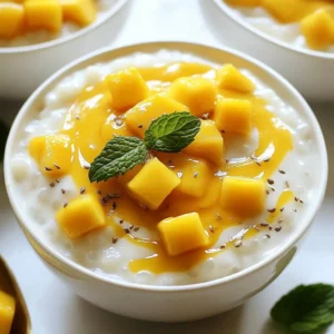 - 1/2 cup small tapioca pearls - 2 cups coconut milk - 1 cup mango puree (fresh or canned) - 1/4 cup sugar (adjust to taste) - 1/2 teaspoon vanilla extract - 1/4 teaspoon salt The main ingredients of this pudding create a creamy and fruity dessert. The small tapioca pearls are key. They give the pudding its unique texture. You can find them easily in most grocery stores. Coconut milk adds richness and a tropical taste. The mango puree brings sweetness and bright flavor. You can use fresh mango or canned puree based on what you have. - 1 ripe mango, diced (for topping) - Mint leaves (for garnish) The toppings make this pudding even better. Fresh diced mango adds a burst of flavor. It also gives a nice color contrast. Mint leaves bring a refreshing touch. They look great on top of the pudding. You can use fresh or canned mango puree for this recipe. Fresh mango gives a bright taste, while canned is easy and quick. If you want to try a different sweetness, use honey or maple syrup instead of sugar. Just remember to adjust the amount based on your taste. {{ingredient_image_1}} - Rinse the tapioca pearls under cold water. Use a fine-mesh strainer. Keep rinsing until the water runs clear. This step cleans the pearls and helps with cooking. - In a medium saucepan, combine 2 cups of coconut milk, 1/4 cup of sugar, and 1/4 teaspoon of salt. Heat this mixture over medium heat. You want it warm, but not boiling. - Add the rinsed tapioca pearls to the coconut milk mixture. Stir well to mix everything together. - Reduce the heat to low. Let it simmer for 15-20 minutes. Stir occasionally. The tapioca pearls will become translucent, and the mixture will thicken. - Once thickened, remove the saucepan from heat. Add 1/2 teaspoon of vanilla extract and half of the mango puree (reserve the other half for serving). Stir to combine. - Let the pudding cool slightly. Then, transfer it into serving bowls or cups. - Refrigerate the pudding for at least 2 hours. This helps it set completely. - When ready to serve, top each bowl with the reserved mango puree and diced mango. Garnish with fresh mint leaves for a pop of color. Enjoy your delicious coconut mango tapioca pudding! To get the best texture for your pudding, cooking time is key. If you want a thicker pudding, let it simmer a bit longer. Keep stirring as it cooks to avoid sticking. This helps the tapioca pearls cook evenly. The pearls should become clear and slightly chewy. If they are still hard, give them more time. To boost the flavor, try adding a pinch of cinnamon or nutmeg. You can also mix in a splash of lime juice for a zesty kick. Pairing with other fruits, like pineapple or berries, adds freshness. These fruits complement the sweet mango and creamy coconut. Experiment with different fruit combinations to find your favorite. Watch out for overcooking the tapioca. If you cook it too long, the pearls can become mushy. On the other hand, undercooking leaves them hard. Aim for that perfect chewy texture. Also, be careful with sugar. Adding too much can make the pudding overly sweet. Adjust the sugar to your taste for the best result. Pro Tips Perfect Tapioca Texture: Ensure that you rinse the tapioca pearls thoroughly to remove excess starch, which helps achieve a smoother texture in your pudding. Adjusting Sweetness: Taste the pudding before chilling it. You can adjust the sweetness by adding more sugar if desired, but remember that the mango puree will also add sweetness. Chill for Best Results: Allow the pudding to chill for at least 2 hours. This helps the flavors meld together and gives the pudding a firmer texture. Garnish Creativity: Feel free to experiment with toppings! Consider adding toasted coconut flakes or a drizzle of honey for extra flavor and texture. {{image_2}} You can switch up the taste of your coconut mango tapioca pudding in fun ways. One great option is to add passion fruit. The tangy flavor of passion fruit boosts the tropical vibe. Just mix in some fresh passion fruit juice with your mango puree. It adds a zing you will love. Another exciting twist is using green tea. Simply brew some green tea and let it cool. Replace part of the coconut milk with this tea. The earthy notes of green tea mix well with coconut. It offers a unique and calming dessert experience. If you want a vegan version, you are in luck! The recipe is already vegan. Just use plant-based sugar to keep it vegan-friendly. This ensures all your guests can enjoy this pudding. For a low-sugar option, try using a sugar substitute. Stevia or monk fruit sweetener works great. You can adjust the amount to fit your taste. It keeps the pudding sweet without the added sugar. Serving style can change your dessert game. You can create layered dessert cups by alternating layers of pudding and fruit. Start with the pudding, then add diced mango and repeat. This makes a beautiful and tasty treat. Another idea is to serve tapioca in a parfait-style. Use a tall glass and layer tapioca, mango puree, and fresh mango. Top with mint leaves for a pop of color. This style makes each bite a joy. To keep your coconut mango tapioca pudding fresh, store leftovers in the refrigerator. Use a tight lid or plastic wrap to cover the pudding. This helps prevent it from absorbing other smells in the fridge. Glass containers work well for storage. They are easy to clean and do not stain. Can you freeze coconut mango tapioca pudding? Yes, you can freeze it. However, the texture may change once thawed. To freeze, place the pudding in an airtight container. Leave some space at the top, as it may expand. Tips for thawing and serving: When you're ready to eat it, move the container to the fridge for about 6-8 hours. This will help it thaw slowly. Stir it before serving to make it creamy again. You can also add fresh toppings after thawing for a better taste. How long does it last in the fridge? The pudding stays good for about 4-5 days. If you see any water on top or a strange smell, it’s time to toss it. Signs of spoilage include mold and an off taste. Always check before you eat! Tapioca pudding is made from small tapioca pearls, coconut milk, sugar, and salt. You also add vanilla extract for flavor. The main part of this pudding is the tapioca pearls. They come from the cassava root. When cooked, they turn soft and chewy, giving the pudding its unique texture. Yes, you can use many fruits for topping. Some great options include bananas, berries, or kiwi. You can mix and match to find your favorite. Each fruit adds its own flavor and color, making the pudding more exciting. Yes, this pudding is gluten-free. Tapioca pearls do not contain gluten. Coconut milk and fresh fruits are also gluten-free. This dessert is safe for those with gluten allergies or sensitivities. Hydrating tapioca pearls takes about 30 minutes. Rinse them under cold water to remove excess starch. This step helps them cook evenly and become soft. Yes, you can make this pudding ahead of time. It stores well in the fridge for up to 3 days. Just keep it in an airtight container. This makes it a great dessert for parties or gatherings. This blog post reviewed how to make a delicious coconut mango tapioca pudding with simple steps. We covered the key ingredients, from small tapioca pearls to fresh mango, and how to prepare them. I shared tips to perfect the texture and avoid common mistakes. You can even experiment with variations and dietary choices. In the end, making this pudding is easy and rewarding. Enjoy the fresh flavors and create your own twists. Share this treat with family and friends; they will love it!