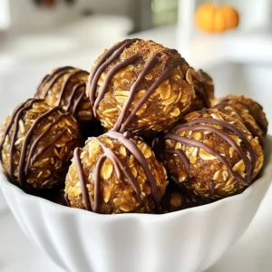 To make Pumpkin Spice Energy Bites, you need some simple and healthy ingredients. Here’s what you will need: - 1 cup rolled oats - 1/2 cup pumpkin puree - 1/2 cup nut butter (almond or peanut) - 1/4 cup honey or maple syrup - 1 tsp pumpkin pie spice - 1/2 tsp vanilla extract - 1/4 cup chia seeds - 1/4 cup chopped nuts (walnuts or pecans) - 1/4 cup dark chocolate chips (optional) Each ingredient plays a key role. The rolled oats provide a good base and add fiber. Pumpkin puree adds moisture and flavor, making the bites soft and tasty. Nut butter gives healthy fats and protein. Honey or maple syrup sweetens the bites naturally. Pumpkin pie spice brings warmth and that lovely fall flavor we all love. Vanilla extract adds depth, while chia seeds pack in nutrients and help bind everything together. Finally, chopped nuts add crunch and richness, and dark chocolate chips can give a sweet treat if you choose to include them. Feel free to mix and match to suit your taste! {{ingredient_image_1}} - Mixing the ingredients Start by grabbing a large mixing bowl. Add 1 cup of rolled oats, 1/2 cup of pumpkin puree, and 1/2 cup of nut butter. You can use almond or peanut butter. Then, pour in 1/4 cup of honey or maple syrup. Mix these ingredients until they blend well. This step creates a base for your tasty bites. - Adding spices and extracts Next, stir in 1 teaspoon of pumpkin pie spice and 1/2 teaspoon of vanilla extract. These flavors will make your bites smell and taste amazing. Mix until everything is evenly flavored. You want every bite to have that warm, spicy taste. - Including chia seeds and nuts Now, add 1/4 cup of chia seeds and 1/4 cup of chopped nuts. You can use walnuts or pecans for a nice crunch. If you like chocolate, toss in 1/4 cup of dark chocolate chips. Mix thoroughly to ensure all ingredients are well combined. The chia seeds add nutrition and keep the bites together. - Forming into balls Using your hands or a tablespoon, scoop out a portion of the mixture. Roll it into a small ball, about 1 inch in diameter. This is where the fun begins! You can make them as big or small as you like, but keep them bite-sized for easy snacking. - Refrigerating for firmness Place the rolled energy bites on a parchment-lined baking sheet or plate. Once all the mixture is rolled out, refrigerate the bites for at least 30 minutes. This helps them firm up, making them easier to eat. You can enjoy them as a healthy snack or energy boost anytime! To make your Pumpkin Spice Energy Bites even better, you can try different nut butters. Almond butter gives a mild taste. Peanut butter adds a richer flavor. Both work great in the recipe. You can also adjust the sweetness. If you like things sweeter, add more honey or maple syrup. For a less sweet bite, use less. Just taste as you mix! Adding mix-ins can change the game. Shredded coconut adds nice texture. Seeds like sunflower or pumpkin can boost nutrition and crunch. Get creative with what you already have! Presentation matters. Serve these bites in a bright bowl, and sprinkle extra pumpkin pie spice on top. This adds color and charm. Think about what to drink with them. A warm cup of tea or coffee pairs well. You can also serve these bites with a smoothie for a tasty breakfast. These energy bites are perfect for many occasions. They make great snacks for movie nights or parties. You can even gift them in small jars for friends or family. Enjoy! Pro Tips Use Fresh Pumpkin: For the best flavor, consider using fresh pumpkin puree instead of canned. Roast and blend your own pumpkin for a richer taste. Chill for Firmness: Allowing the energy bites to chill in the refrigerator for at least 30 minutes will help them hold their shape better when making them. Experiment with Flavors: Feel free to customize the recipe by adding different spices like cinnamon or nutmeg, or by using different types of nut butter for a unique twist. Make Ahead: These energy bites can be made in advance and stored in the fridge for up to a week, making them a perfect grab-and-go snack! {{image_2}} You can easily change up the recipe with some swaps. If you want to skip the chocolate, use dried fruit. Dried cranberries or apricots add a sweet twist. For a different spice flavor, try cinnamon or ginger. You can mix and match spices to find what you love. If you need a gluten-free option, use gluten-free oats. For nut allergies, try sunflower seed butter instead of nut butter. Make these energy bites festive! For the holidays, add a sprinkle of festive colors. You can use red and green sprinkles to make them pop. For Halloween, shape them into little pumpkin balls. You can use orange food coloring and add candy eyes for fun. These small changes make your bites perfect for any occasion! To keep your Pumpkin Spice Energy Bites fresh, store them in an airtight container. Glass jars work great for this. You can also use plastic containers with a tight lid. If you want to freeze them, place the bites in a single layer on a baking sheet. After they freeze solid, move them to a freezer bag. This way, they won’t stick together. In the fridge, these bites last about one week. For a healthy snack, one or two bites are perfect. They give you energy without too many calories. If you’re on the go, pack a few in a small bag. They make a great pre-workout snack or a treat after school. Can I use canned pumpkin? Yes, you can use canned pumpkin. It saves time and is still tasty. Make sure to choose plain pumpkin, not pumpkin pie filling. This keeps the flavor right. How long do the energy bites last? These energy bites last about one week in the fridge. Store them in a sealed container to keep them fresh. You can also freeze them for up to three months. Are these energy bites vegan-friendly? Yes, these energy bites can be vegan. Use maple syrup instead of honey. Choose almond butter or any plant-based nut butter. What’s the best nut butter to use? Almond butter works well, but peanut butter is great too. Choose what you like best. Each nut butter adds a unique flavor to the bites. How can I make these bites more nutritious? To boost nutrition, add seeds like pumpkin or sunflower seeds. You can also mix in dried fruit or protein powder. These add extra vitamins and minerals. You learned how to create tasty pumpkin spice energy bites. We covered key ingredients, step-by-step instructions, and helpful tips. You can customize flavors, swap ingredients, and store them well. These bites fit any season and occasion. Try making them your own with different spices and mix-ins. Enjoy these snacks while staying healthy!