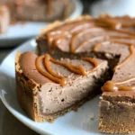 To create a delicious Caramel Macchiato Cheesecake, gather these ingredients: - 1 ½ cups graham cracker crumbs - ½ cup unsalted butter, melted - 1 tablespoon sugar - 16 oz cream cheese, softened - ¾ cup granulated sugar - 1 cup heavy cream - 3 large eggs - 2 teaspoons vanilla extract - 2 tablespoons espresso powder - ½ cup caramel sauce (plus extra for drizzling) - Pinch of salt If you need substitutes, here are some options: - Graham cracker crumbs: Use crushed cookies like Digestives or Oreos. - Unsalted butter: You can use margarine or coconut oil instead. - Heavy cream: Try full-fat coconut milk for a dairy-free version. - Cream cheese: Use vegan cream cheese or silken tofu blended until smooth. - Granulated sugar: You can use coconut sugar or a sugar alternative like Stevia. - Espresso powder: Instant coffee granules work well in a pinch. Here are some brands I love for these ingredients: - Graham cracker crumbs: Nabisco or Keebler - Cream cheese: Philadelphia or Kite Hill (for vegan) - Heavy cream: Horizon Organic or Organic Valley - Caramel sauce: Smucker's or Torani - Espresso powder: Medaglia d'Oro or Starbucks These ingredients will help you make a rich and flavorful Caramel Macchiato Cheesecake. Each one adds to the overall taste and texture, making your dessert a real treat. Happy baking! {{ingredient_image_1}} First, preheat your oven to 325°F (163°C). This temperature helps the cheesecake bake evenly. While the oven warms up, gather your tools. You will need a 9-inch springform pan and mixing bowls. In a bowl, mix 1 ½ cups of graham cracker crumbs, ½ cup of melted unsalted butter, and 1 tablespoon of sugar. Combine them well until they look like wet sand. Press this mixture firmly into the bottom of the springform pan. It should form an even layer. Bake the crust for 10 minutes. After baking, let it cool while you prepare the filling. In a large mixing bowl, beat 16 oz of softened cream cheese with ¾ cup of granulated sugar. Mix until the mixture is smooth and creamy. Next, add 1 cup of heavy cream, 3 large eggs, 2 teaspoons of vanilla extract, 2 tablespoons of espresso powder, ½ cup of caramel sauce, and a pinch of salt. Mix on low speed until everything is fully combined. Be careful not to overmix, as this can affect the texture. Pour the cheesecake batter over the cooled crust in the springform pan. Tap the pan gently on the counter to let air bubbles escape. Bake in the preheated oven for 50 to 60 minutes. The edges should be set, but the center can still jiggle slightly. This slight jiggle means it will set perfectly as it cools. Once baked, turn off the oven and crack the door open. Let the cheesecake cool in the oven for 1 hour. This slow cooling helps prevent cracks. After an hour, cover the cheesecake and refrigerate it for at least 4 hours, but overnight is best for the flavors to meld. When ready to serve, carefully remove the cheesecake from the springform pan. Drizzle the top with extra caramel sauce for a touch of sweetness. Cut the cheesecake into slices and enjoy this rich and flavorful treat! When making Caramel Macchiato Cheesecake, avoid overmixing the batter. This can cause cracks. Make sure to beat the cream cheese until smooth, but stop once you add the eggs. Also, do not skip cooling the cheesecake in the oven. This step helps prevent cracks by letting it cool slowly. Lastly, use room temperature ingredients for a better mix. To get a creamy and smooth texture, follow these steps. First, beat the cream cheese well to eliminate lumps. Then, add heavy cream and mix on low. This keeps the air out, which can make your cheesecake dense. Bake until the edges are set but the center jiggles slightly. This gives a nice, soft texture once cool. Let your cheesecake chill for at least four hours. For the best flavor, serve it slightly cold, around 45°F (7°C). This lets the flavors shine through. Before serving, drizzle some caramel sauce on top. It adds a lovely touch and enhances the coffee flavor. Enjoy every bite! Pro Tips Use Room Temperature Ingredients: Ensure your cream cheese and eggs are at room temperature for a smoother batter. This helps in achieving a creamy texture without lumps. Don’t Overmix: Mix your ingredients on low speed and only until combined. Overmixing can incorporate too much air, leading to cracks in your cheesecake. Use a Water Bath: If you want to prevent cracks, bake your cheesecake in a water bath. Wrap the springform pan in foil and place it in a larger pan filled with hot water while baking. Chill Overnight: For the best flavor and texture, chill your cheesecake overnight. This allows the flavors to meld beautifully and ensures a firm slice. {{image_2}} You can change the flavor of your cheesecake. Try adding different extracts. Almond or hazelnut can bring a new twist. You can even use flavored coffee syrups. This will enhance the caramel macchiato taste. For a chocolate version, mix in cocoa powder. You can also add chocolate chips for extra richness. If you want to switch up the crust, there are many options. Use crushed Oreos for a chocolatey base. You can also make a nut-based crust using ground almonds or pecans. A cookie crust made from ginger snaps can add a spicy kick. Just remember to adjust the butter amount based on your crust choice. Toppings can take your cheesecake to the next level. Drizzle more caramel sauce on top for extra sweetness. You can also sprinkle crushed espresso beans for a crunchy texture. Whipped cream adds a light, airy touch. For a fruity twist, top with fresh berries. Each topping can create a new dessert experience. To keep your Caramel Macchiato Cheesecake fresh, wrap it well. Use plastic wrap or foil. You can also store it in an airtight container. Place it in the fridge. It will stay good for about 4 to 5 days. Make sure to keep it chilled. This way, the creamy texture remains perfect. If you want to save some for later, freezing works great! First, let the cheesecake cool completely. Once cooled, slice it into pieces. Wrap each piece tightly in plastic wrap. Then, place the slices in a freezer-safe bag. You can freeze it for up to 2 months. When you’re ready, just thaw it in the fridge overnight. Reheating cheesecake isn’t really needed, but if you want it a bit warm, here’s how. Preheat the oven to 250°F (120°C). Place the cheesecake slices on a baking sheet. Heat for about 15-20 minutes. Keep an eye on it to avoid overcooking. This will help to bring back its creamy texture and flavor. Enjoy your delicious treat! Yes, you can make this cheesecake a day or two ahead. It tastes even better after chilling. Just make sure to store it in the fridge. Cover it well to keep it fresh. If you don’t have espresso powder, you can use instant coffee granules. Just use the same amount. You can also brew strong coffee and reduce it. This gives a similar flavor but may change the texture slightly. The cheesecake is done when the edges are set but the center jiggles slightly. It should not be liquid. A slight jiggle means it will firm up as it cools. Yes, you can use other sweeteners. Try monk fruit, agave, or honey. Just remember to adjust the amount to match the sweetness you want. To cut cheesecake, use a sharp knife. Dip the knife in hot water and wipe it dry. This helps make clean cuts. Cut the cheesecake into slices and serve. Enjoy every delicious bite! This guide covered everything you need for perfect Caramel Macchiato Cheesecake. I shared key ingredients, easy steps, and tips to avoid mistakes. You learned how to store leftovers and variations to try. Enjoy experimenting with flavors or toppings to make it your own. Cheesecake is a fun treat to master, so don't be afraid to get creative! Happy baking!