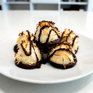 To make these tasty chocolate dipped coconut macaroons, gather these ingredients: - 3 cups shredded unsweetened coconut - 1 cup sweetened condensed milk - 1 teaspoon vanilla extract - 1/4 teaspoon salt - 1 cup semi-sweet chocolate chips - 1 tablespoon coconut oil Selecting the best ingredients is key to great macaroons. Here&rsquo;s how: - Coconut: Look for unsweetened shredded coconut. This gives you control over sweetness. - Sweetened Condensed Milk: Choose a brand without added preservatives. It ensures a rich flavor. - Chocolate Chips: Opt for semi-sweet chocolate chips for a perfect balance. - Coconut Oil: Use pure coconut oil, which adds a nice hint of coconut flavor. If you have allergies, here are some swaps you can try: - Coconut: If you can&rsquo;t eat coconut, consider using oats. They won&rsquo;t taste the same, but they work in texture. - Condensed Milk: Use a dairy-free sweetened condensed milk made from almond or soy. - Chocolate Chips: Use dairy-free or dark chocolate chips for a vegan option. - Coconut Oil: Substitute with any neutral oil, like grapeseed or canola oil, if needed. {{ingredient_image_1}} To start, gather your ingredients. You need 3 cups of shredded unsweetened coconut, 1 cup of sweetened condensed milk, 1 teaspoon of vanilla extract, and 1/4 teaspoon of salt. In a large bowl, mix the coconut with the sweetened condensed milk. Add the vanilla and salt, then stir well. You want the coconut to be coated fully. This mix will be the base of your macaroons. Now it&rsquo;s time to shape the macaroons. Use your hands to form small mounds. Each mound should be about the size of a golf ball. Space them about 1 inch apart on a baking sheet lined with parchment paper. Preheat your oven to 325&deg;F (160&deg;C). Bake the macaroons for about 20 to 25 minutes. They are done when the edges turn golden brown. After baking, let them cool completely on the sheet. While your macaroons cool, prepare the chocolate dip. You need 1 cup of semi-sweet chocolate chips and 1 tablespoon of coconut oil. In a microwave-safe bowl, combine these two ingredients. Microwave in 30-second bursts, stirring in between. Keep going until the chocolate is smooth. Once cooled, dip the bottom half of each macaroon into the melted chocolate. Allow the excess chocolate to drip off. Place them on a fresh sheet of parchment paper to set. For quicker results, chill them in the fridge. For the best bake, keep a close eye on your macaroons. Bake them at 325&deg;F (160&deg;C). Watch for golden edges, which show they are done. If they look too brown, you may overbake them. Using parchment paper helps prevent sticking and makes cleanup easy. Let them cool completely on the sheet before moving them. This helps them stay firm. To get a smooth chocolate dip, use semi-sweet chocolate chips and a bit of coconut oil. This oil helps the chocolate melt smoothly. Microwave the chocolate in short bursts, stirring in between. Don&rsquo;t rush this step; patience gives you the best dip. Dip each macaroon halfway, letting the extra chocolate drip off. This makes them look neat and tasty. Store any leftover macaroons in an airtight container. They stay fresh this way for up to a week. If you want to keep them longer, try freezing them. Just place them in a freezer-safe container. When you're ready to eat them, let them thaw in the fridge. This keeps them from getting soggy. Enjoy your sweet treats! Pro Tips Use Fresh Coconut: For a more vibrant flavor, use freshly shredded coconut instead of packaged. It enhances the taste and texture of the bites. Experiment with Flavors: Consider adding a pinch of cinnamon or almond extract to the coconut mixture for a unique twist that complements the chocolate. Chill Before Dipping: Refrigerating the macaroons for 15-20 minutes before dipping them in chocolate will help them hold their shape better. Store Properly: Keep the finished Coconut Bliss Bites in an airtight container in the fridge for up to a week to maintain their freshness. {{image_2}} You can easily add fun flavors to your coconut macaroons. Try mixing in almond extract or coffee. For almond, use one teaspoon of almond extract instead of vanilla. This gives a nice nutty flavor. If you love coffee, add one tablespoon of instant coffee granules to the coconut mix. This will make your macaroons rich and tasty. You can change the chocolate used for dipping. While semi-sweet chocolate is a classic, try dark or white chocolate. Dark chocolate gives a bold taste. White chocolate adds a sweet creaminess. Melt them just like the semi-sweet chocolate. You can even mix chocolates for a fun look. Dip half in dark and half in white for a cool two-tone effect. If you want to make a healthier version, swap out some ingredients. Use light sweetened condensed milk for a lower calorie option. You can also use dark chocolate with a higher cocoa content. This gives more flavor and less sugar. For a nut-free option, use almond milk instead of sweetened condensed milk. This keeps the dish tasty and lower in calories. To keep your macaroons fresh, store them in an airtight container. This helps prevent them from drying out. Place a layer of parchment paper between layers of macaroons. This stops them from sticking together. Keep the container in a cool, dry place away from sunlight. Avoid the fridge, as it can make them soggy. Freezing your macaroons is easy and keeps them tasty. First, let the macaroons cool completely after dipping in chocolate. Then, place them on a baking sheet lined with parchment paper. Freeze them for about an hour until firm. After that, transfer the macaroons to a freezer-safe bag. Remove as much air as possible before sealing. They will stay fresh for up to three months in the freezer. Chocolate dipped coconut macaroons last for about one week at room temperature. If stored correctly in an airtight container, they can retain their taste and texture. If you freeze them, they can last up to three months. Remember to check for any signs of freezer burn or changes in texture when you thaw them. Enjoy your sweet treats anytime! The best way to melt chocolate is in the microwave. Use a microwave-safe bowl for this. Place your chocolate chips and a bit of coconut oil in the bowl. Heat it for 30 seconds, then stir. Repeat this until the chocolate is smooth. This method helps prevent burning. You can also use a double boiler if you prefer. You can use dried coconut, but it may change the texture. Shredded coconut has more moisture. This moisture helps bind the macaroons. If you only have dried, consider adding a bit of water. This will help with the mix. To prevent sticking, use parchment paper. Line your baking sheet with it before baking. You can also lightly grease the paper with coconut oil. This will help the macaroons come off easily. Let them cool completely before moving them. Yes, chocolate-dipped coconut macaroons are gluten-free. The main ingredients are coconut and chocolate, which do not contain gluten. Always check your chocolate's label to ensure it's gluten-free. This way, you can enjoy these treats without worry. This blog post covered all you need to make delicious coconut macaroons. We looked at the key ingredients and tips for choosing quality ones. You learned to prepare the coconut mixture, shape the cookies, and dip them in chocolate. I also shared tips for baking, storing, and even variations to try. In the end, making macaroons can be fun and simple. With the right ingredients and steps, you will enjoy a tasty treat that you can customize. Try making them and enjoy the satisfaction of baking!